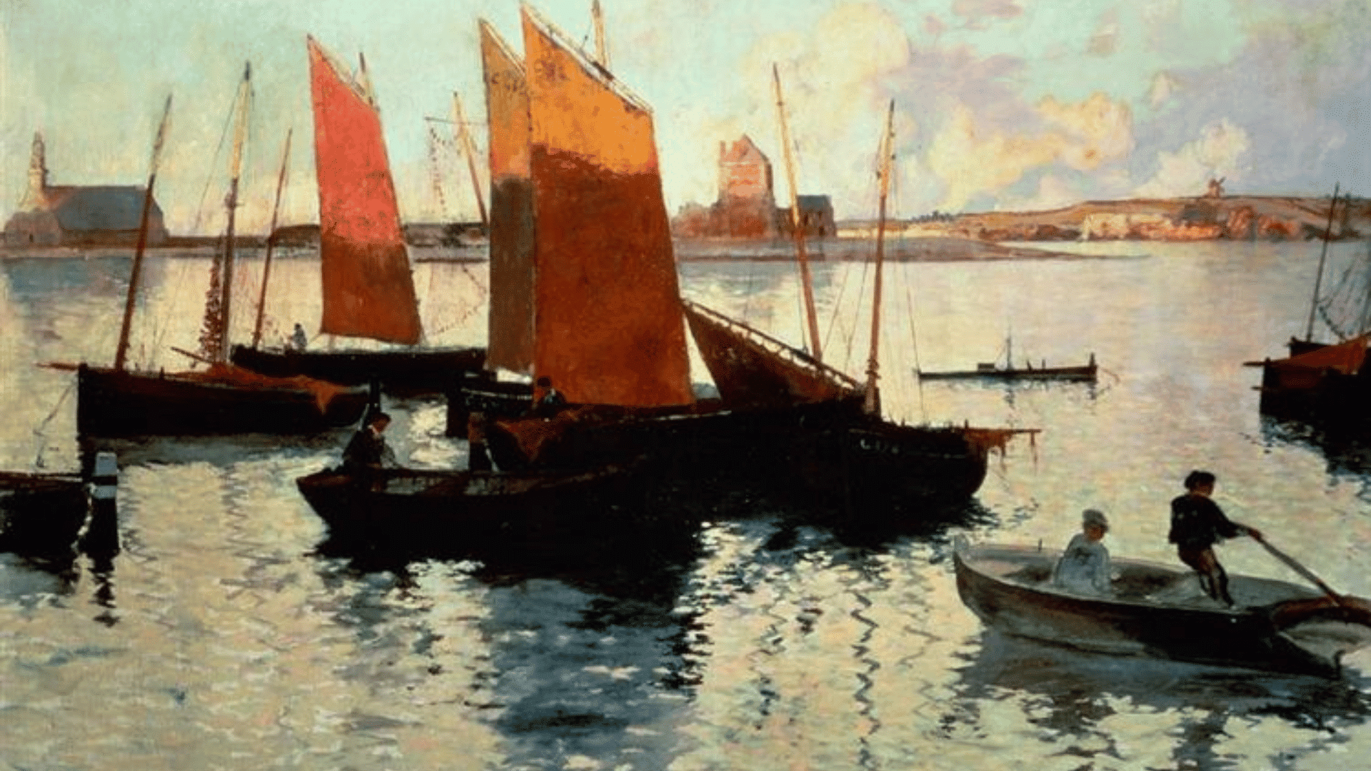 Boats with red sails floating on calm water at sunset, reflections shimmering across the harbor.