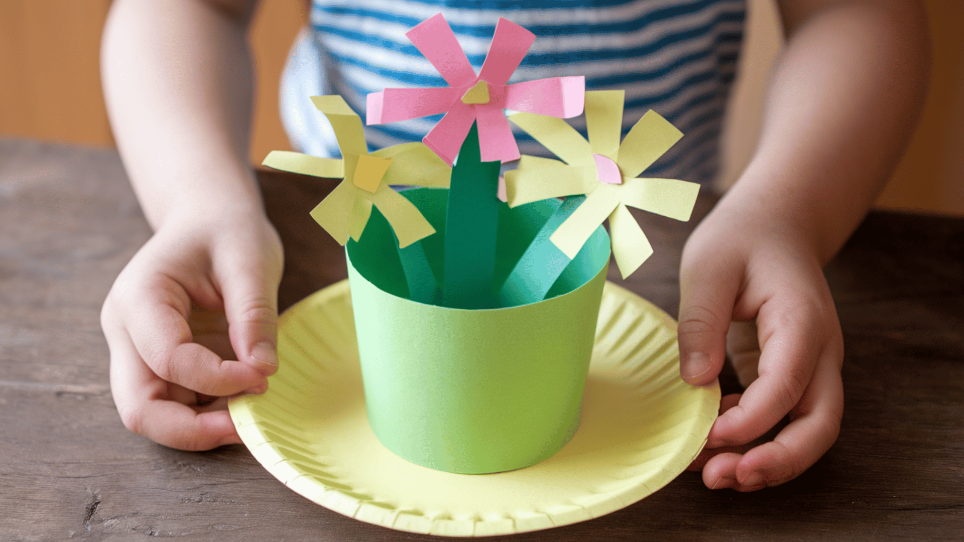 a beautiful flower pot made of paper with yellow flowers