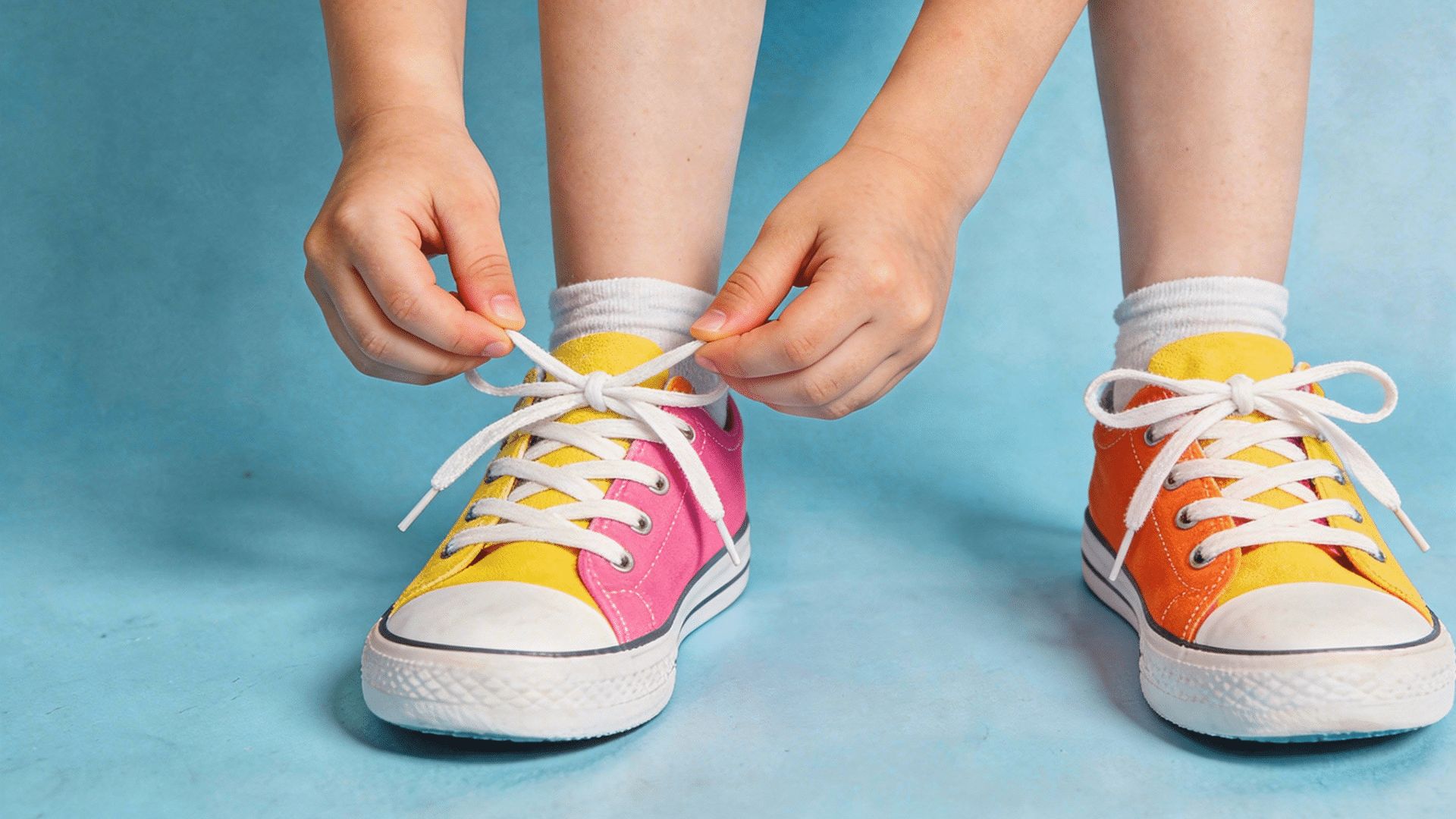 child practicing bunny ears method while learning to tie shoes, step by step (1)
