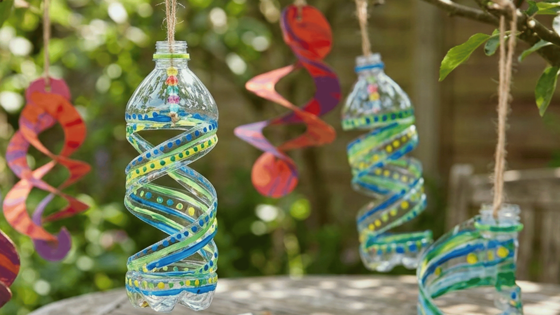 colorful diy wind spinner hanging outdoors and spinning in the breeze
