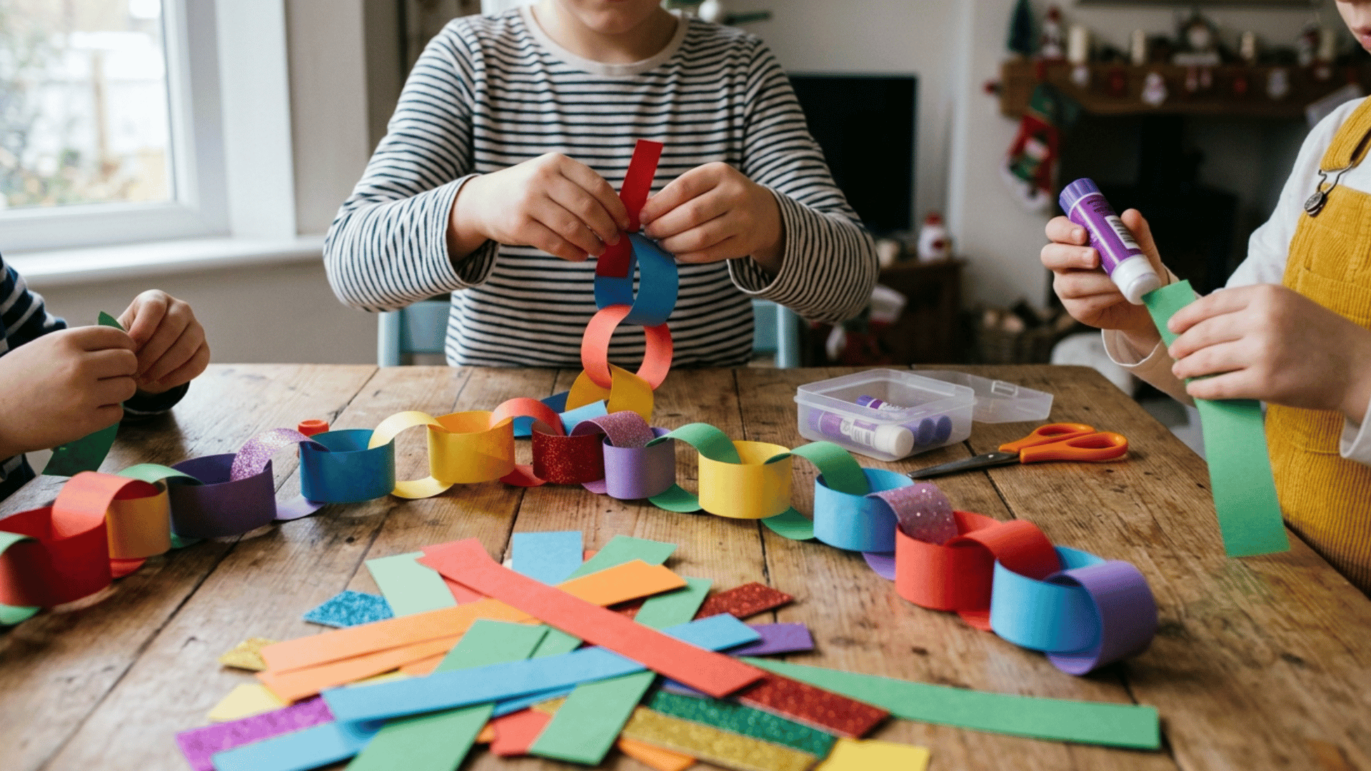 colorful paper chain decorations hanging across a room for kids craft activity