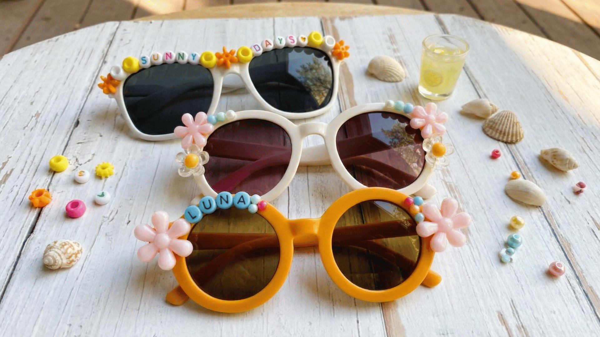 customized white sunglasses with colorful letter beads, and flowers