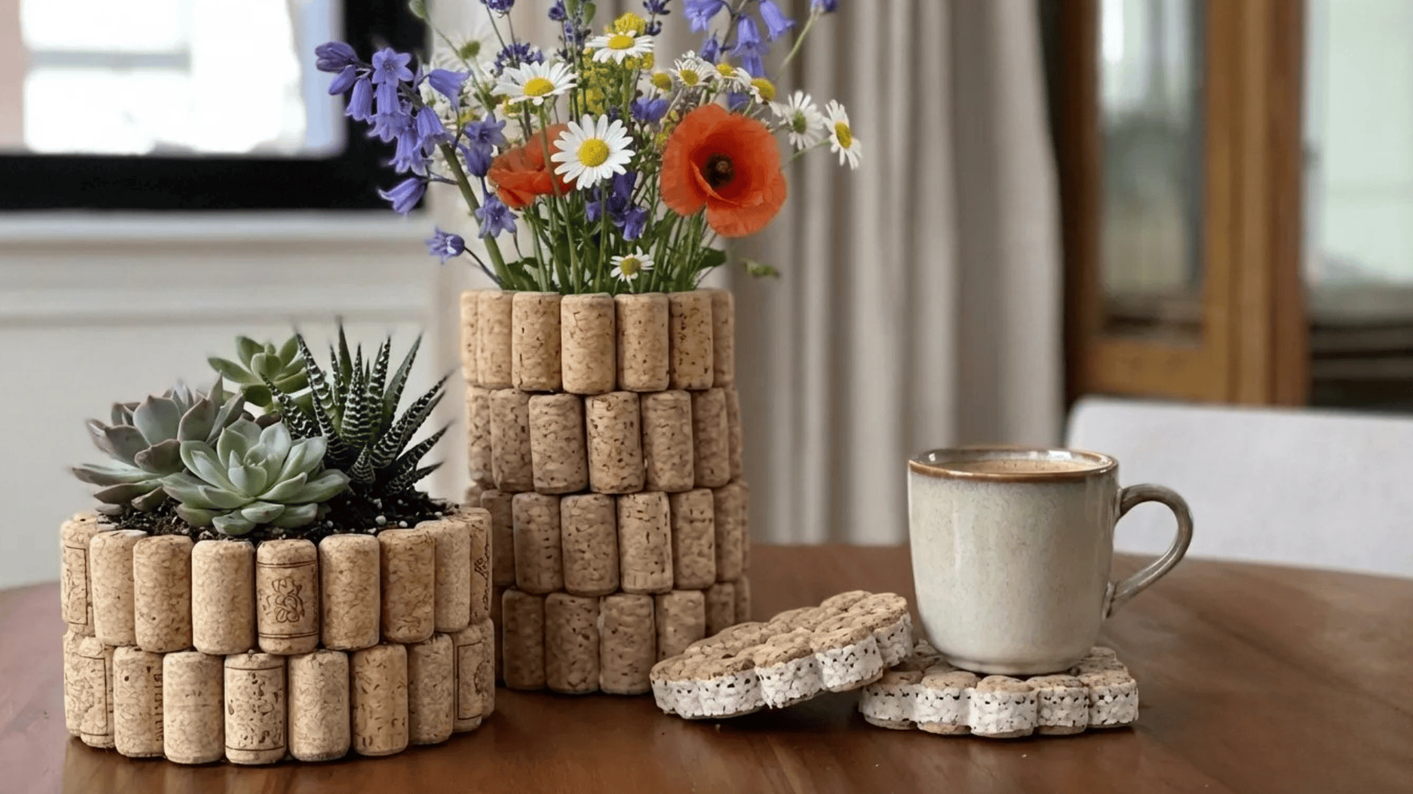 diy cork crafts including wine cork planters, tulip vase, and cork coasters displayed on a wooden table