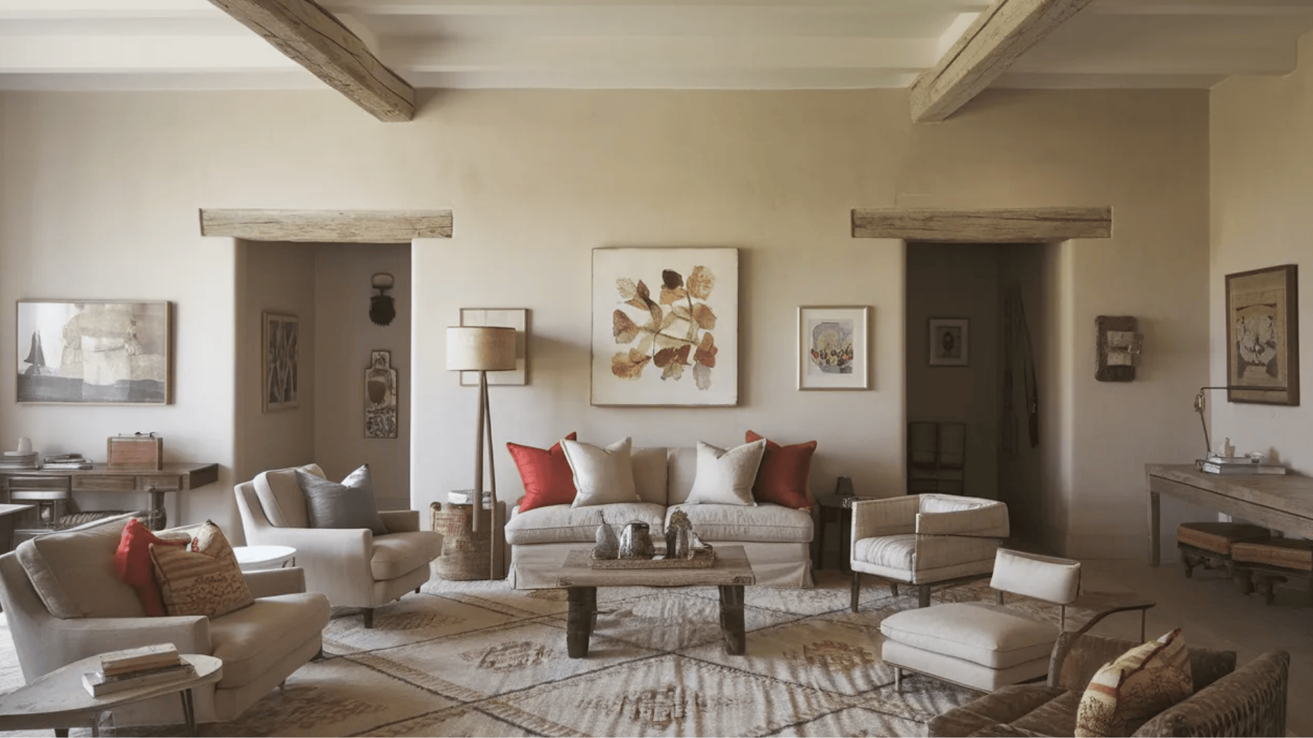 elegant living room with exposed beams, neutral furniture, and pops of color from pillows and artwork, creating a welcoming space