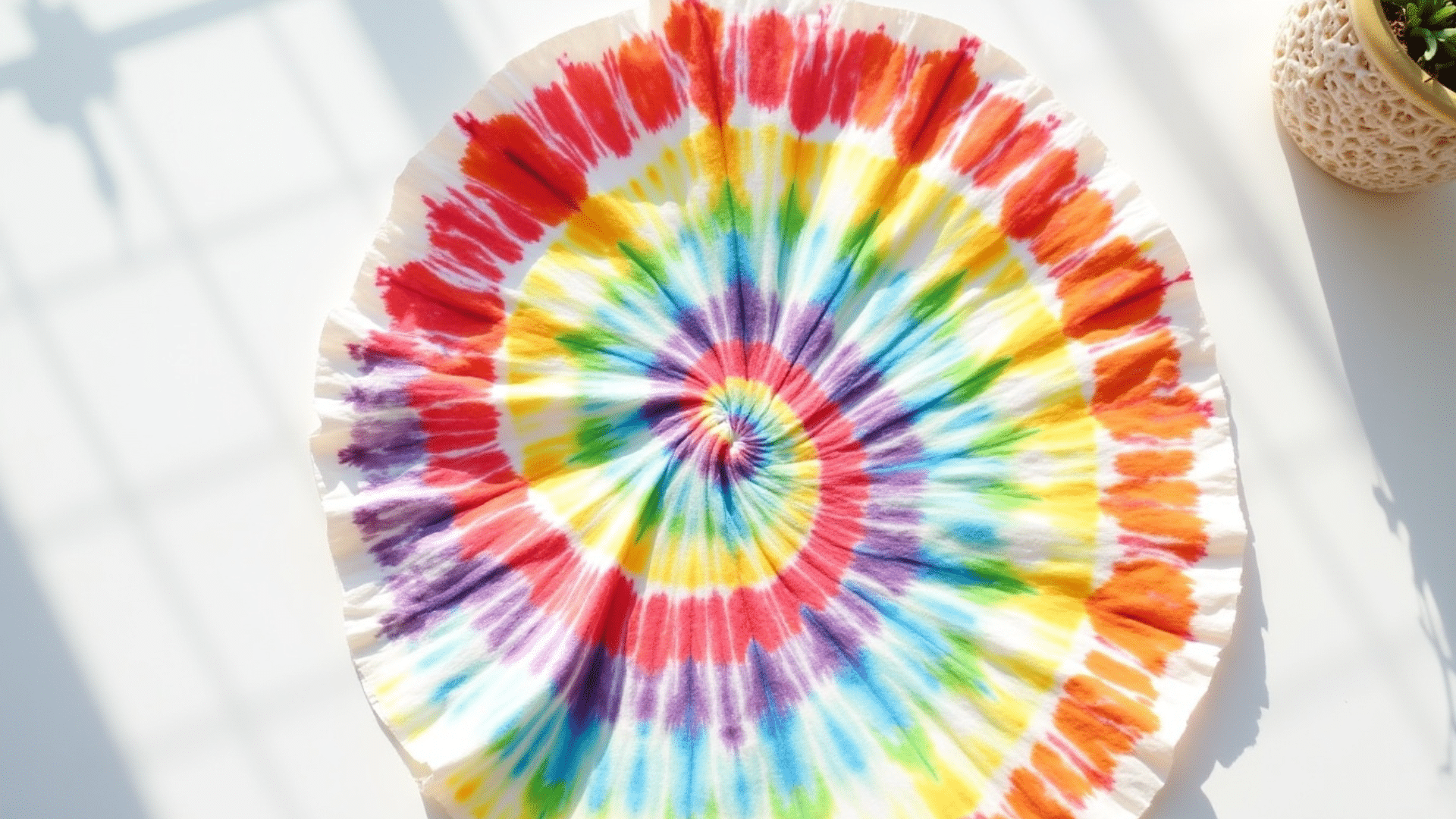 flat coffee filter with multiple color bleed creating a tie-dye effect