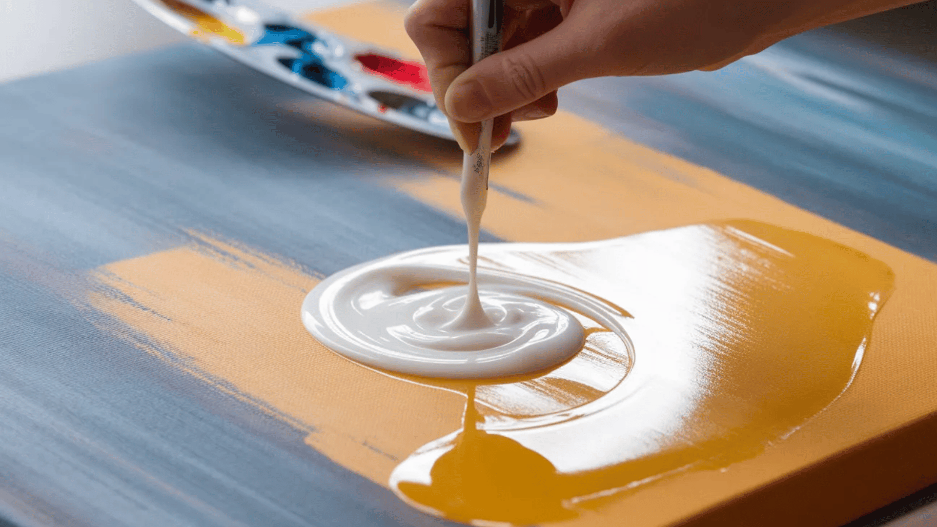 glossy abstract art with acrylic gel medium creating a shiny reflective surface