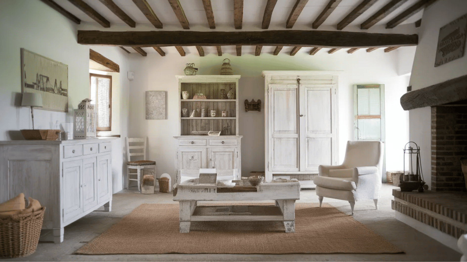 living room with rustic whitewashed furniture, exposed wooden beams, and earthy accents for a cozy, relaxed feel