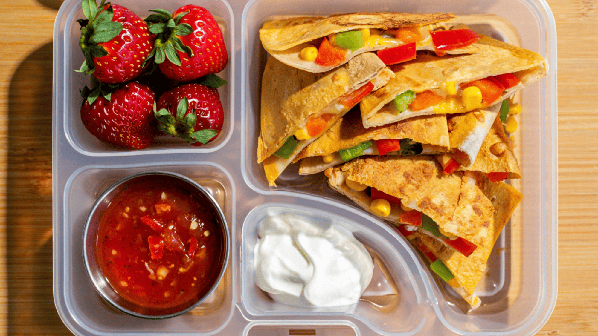 mini veggie quesadillas in a three department lunch