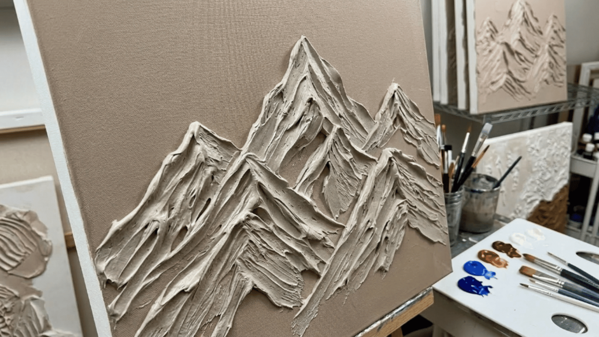 modeling paste applied with palette knife forming thick raised texture on canvas surface