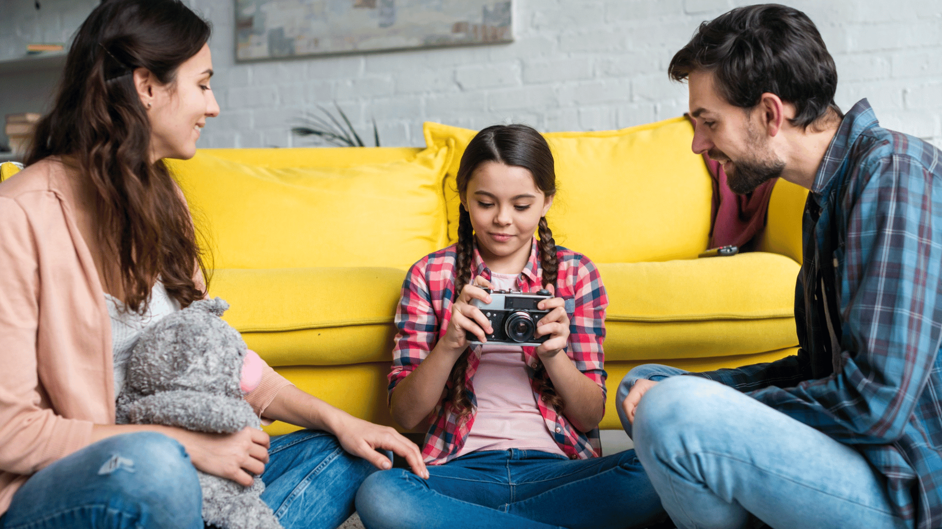 parent sitting with their daughter, talking and listening carefully to understand her feelings and challenges.