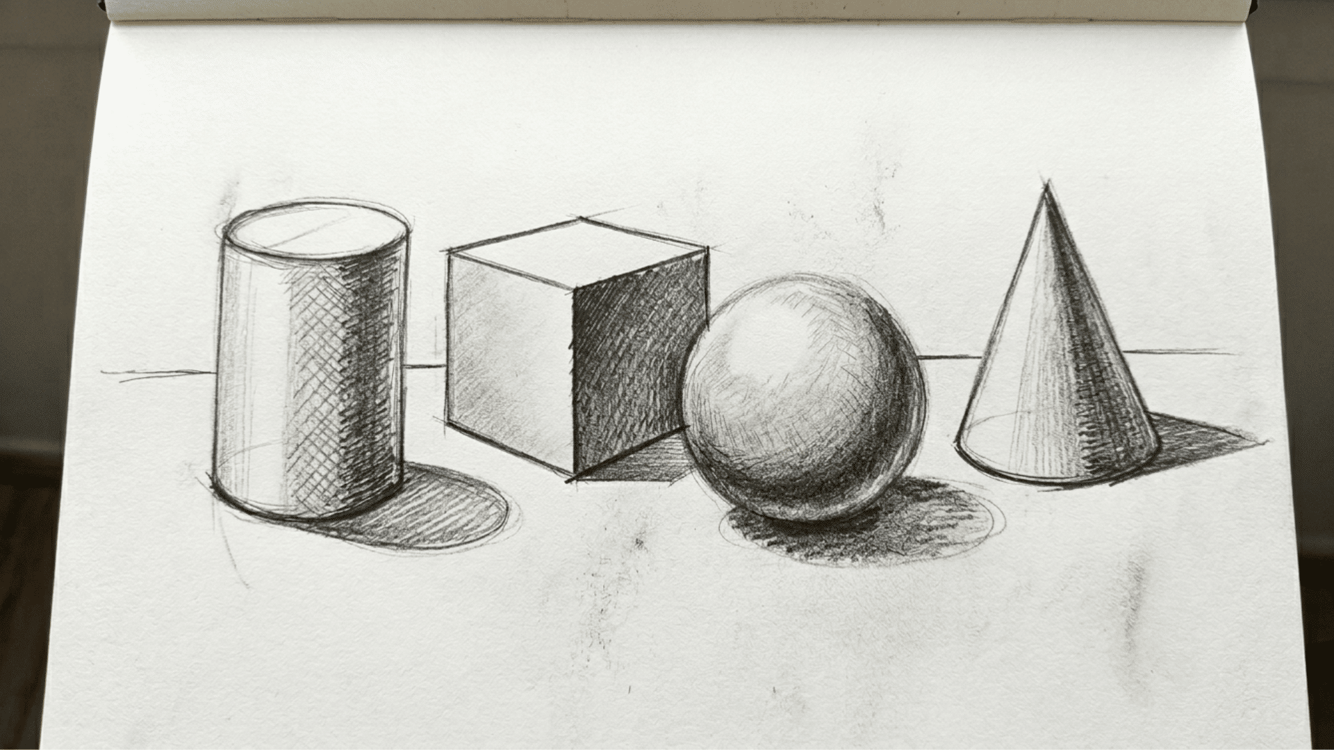 pencil drawing of 3d forms including cylinder cube sphere and cone with shading practice