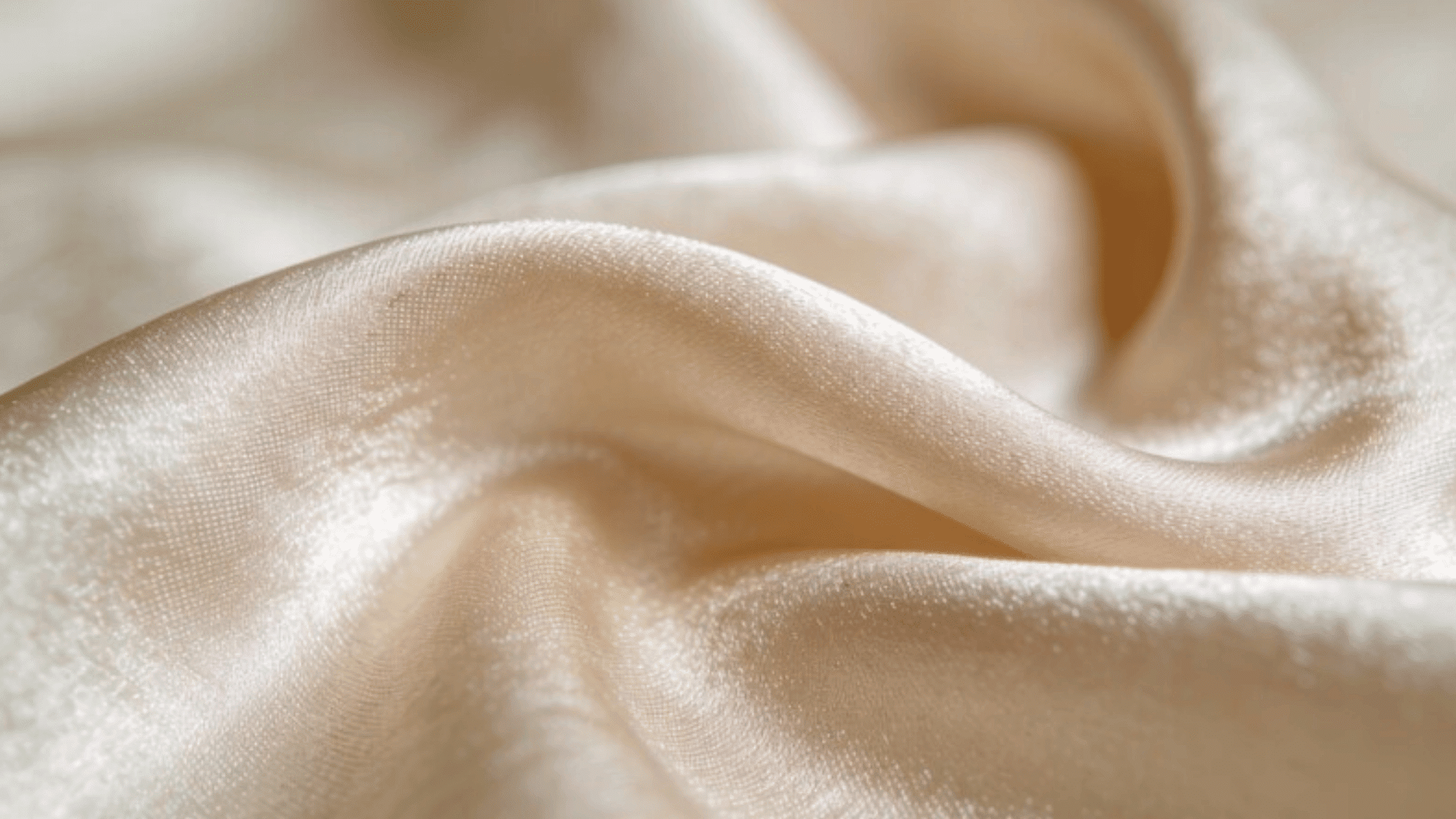 smooth silk cloth, elegant folds, muted blush hue, visible thread weave