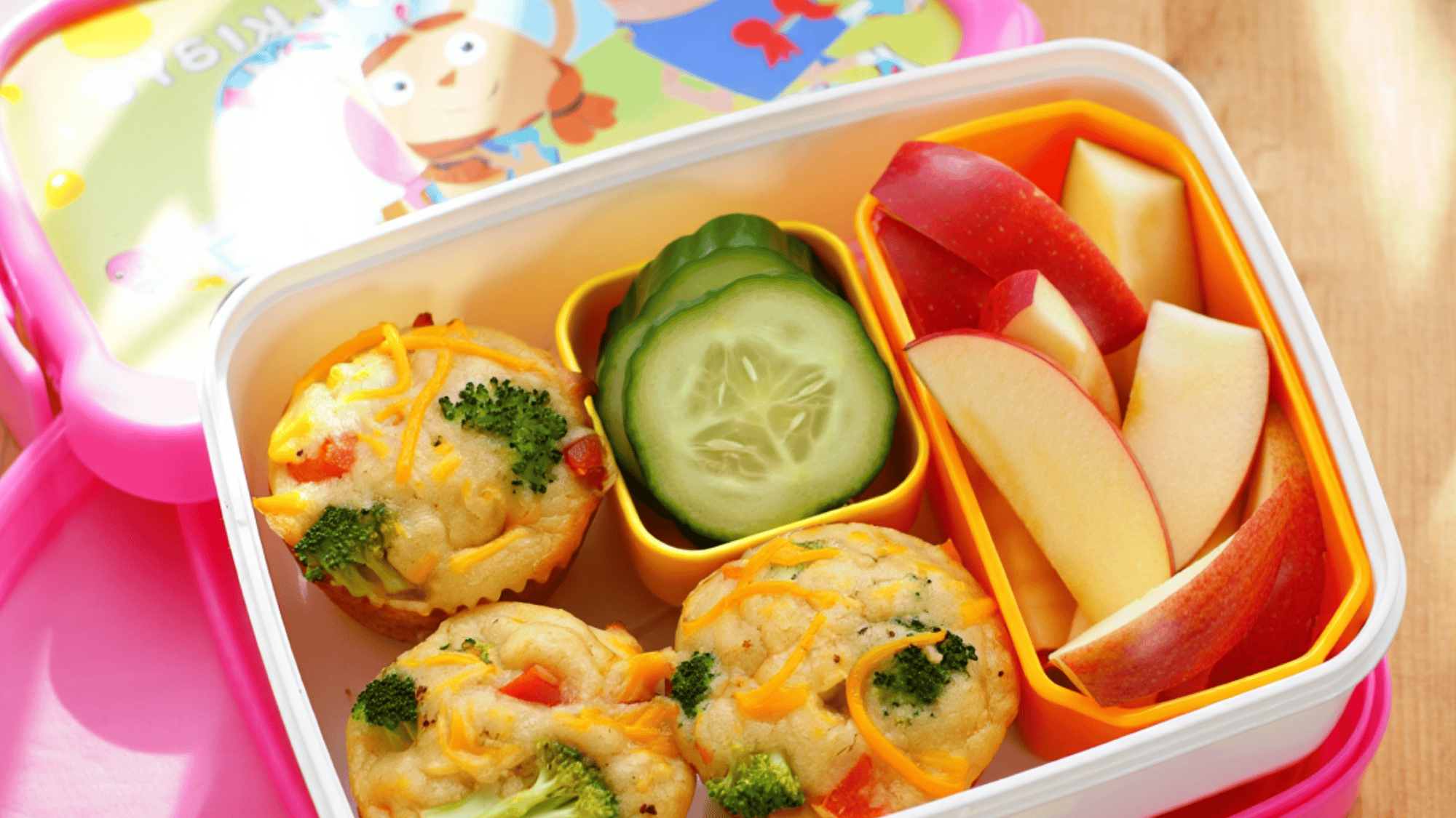 veggie and cheese muffins in a pink lunch