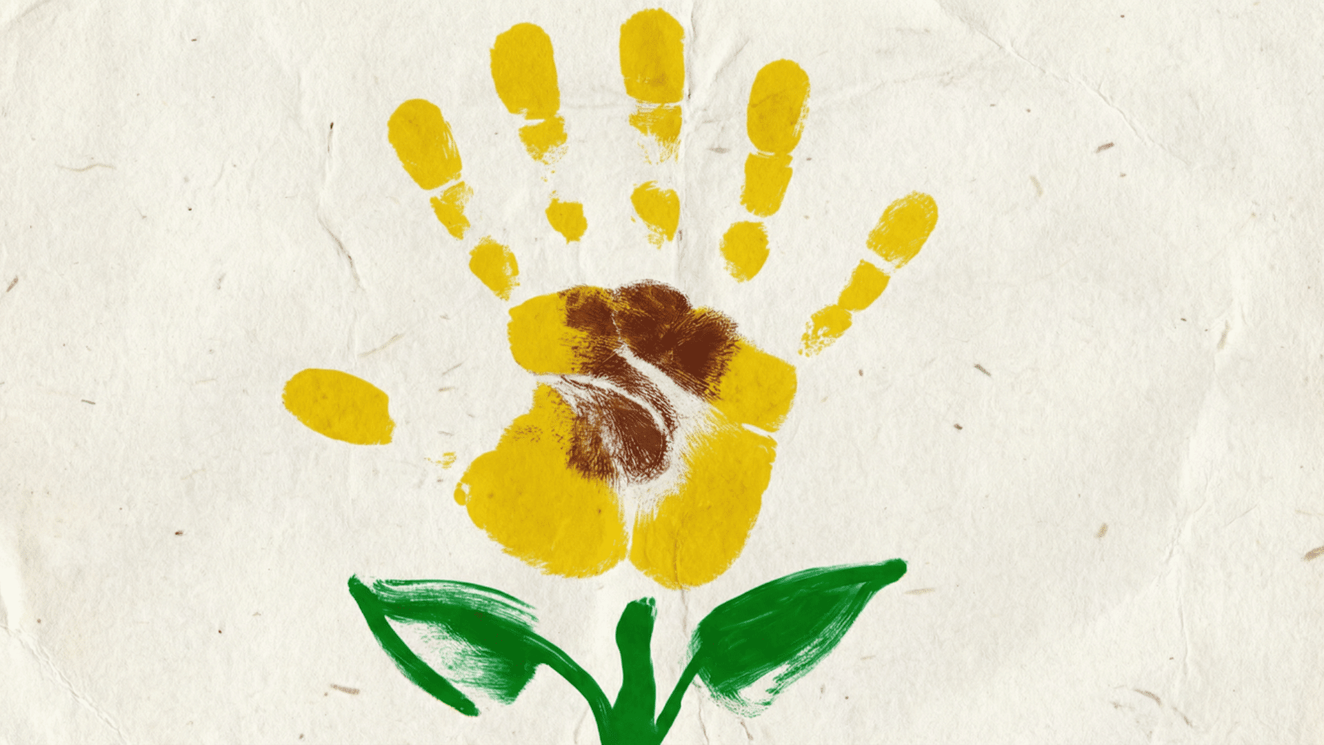 yellow handprint forming sunflower petals, brown thumbprint center, green stem and leaves