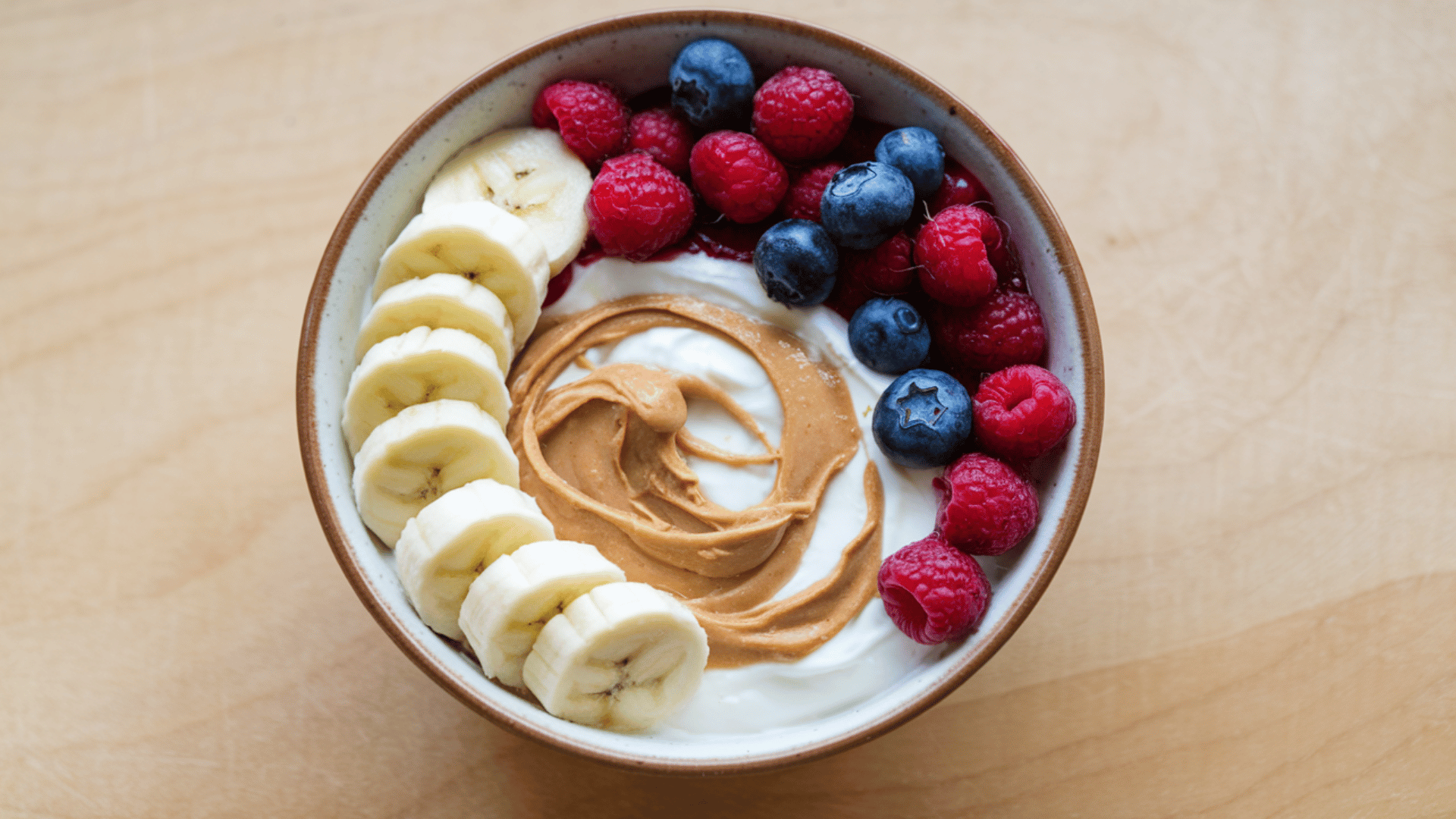 Greek Yogurt with a Swirl of Nut Butter Plain Greek yogurt with a swirl of almond or peanut butter is a filling and satisfying snack with real staying power. png