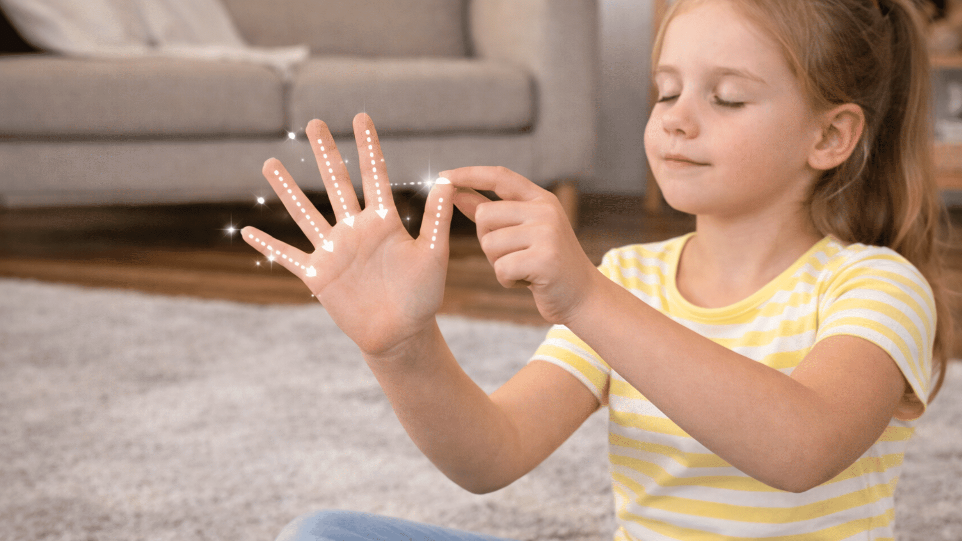 a young girl traces her hand for breathing exercises while sitting on the rug with a peaceful look.