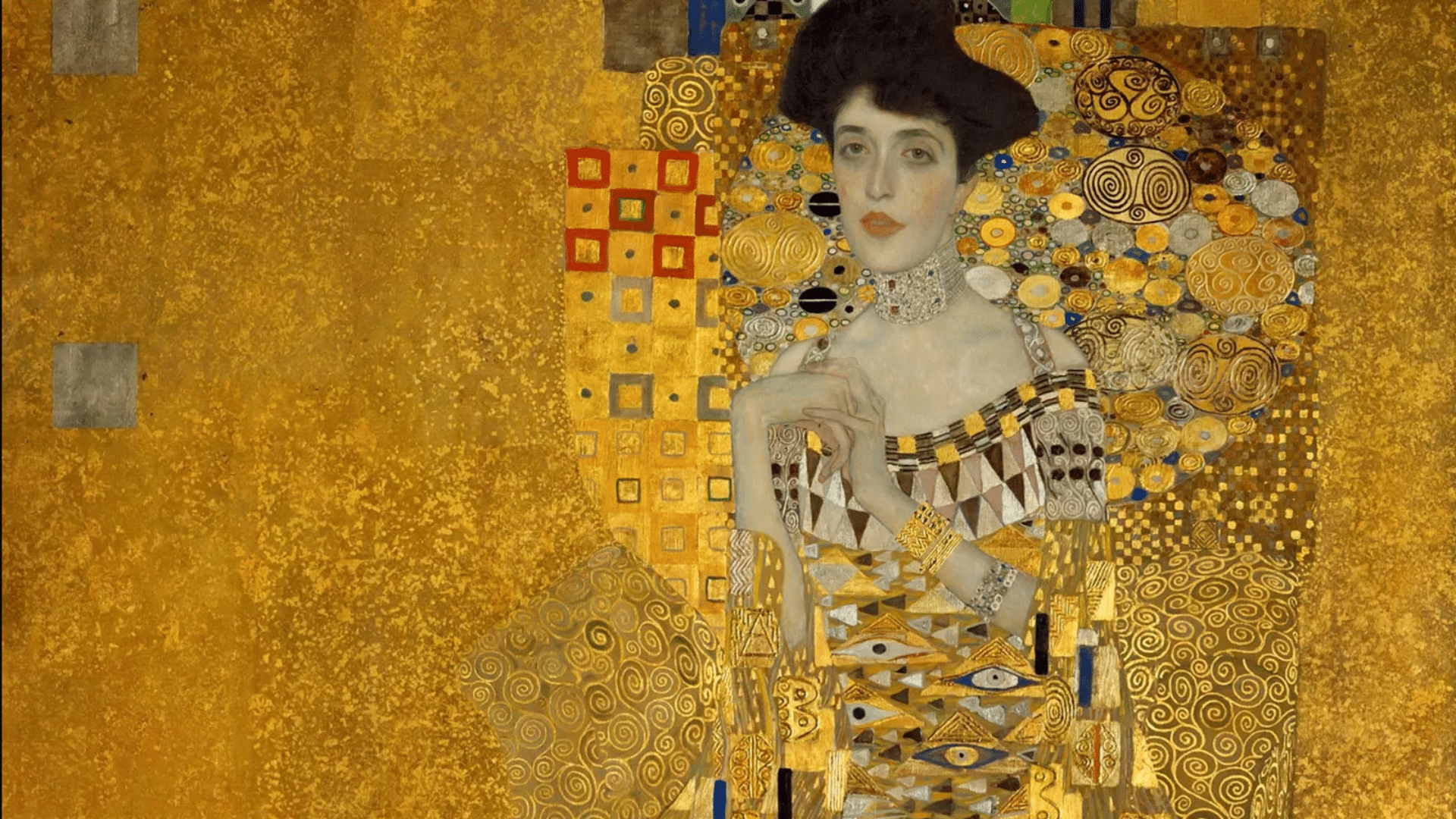 art nouveau featuring a richly decorated female figure surrounded by ornate gold patterns and flowing decorative forms
