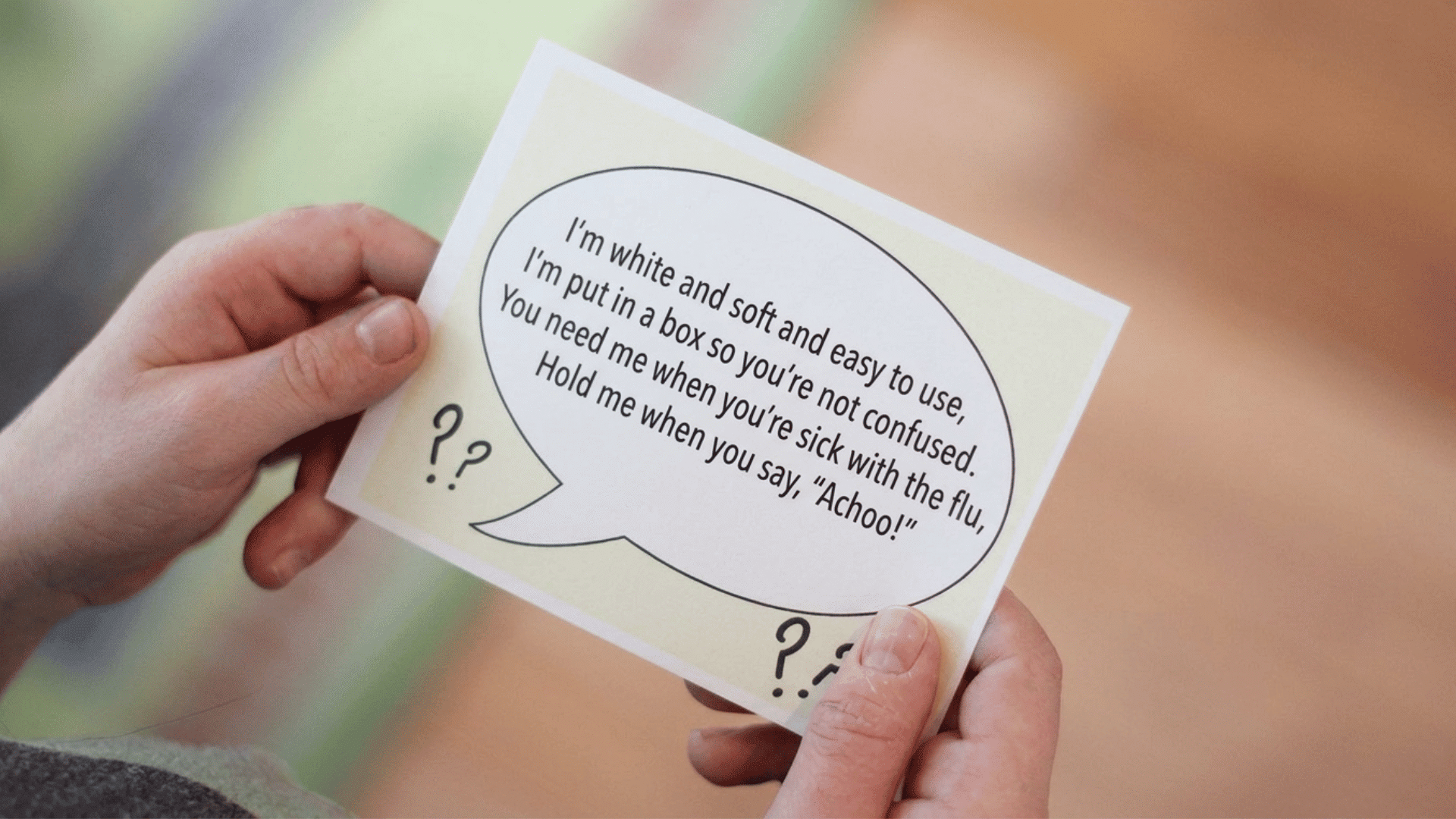 child holding scavenger hunt riddle card and reading clue indoors during fun indoor scavenger hunt activity