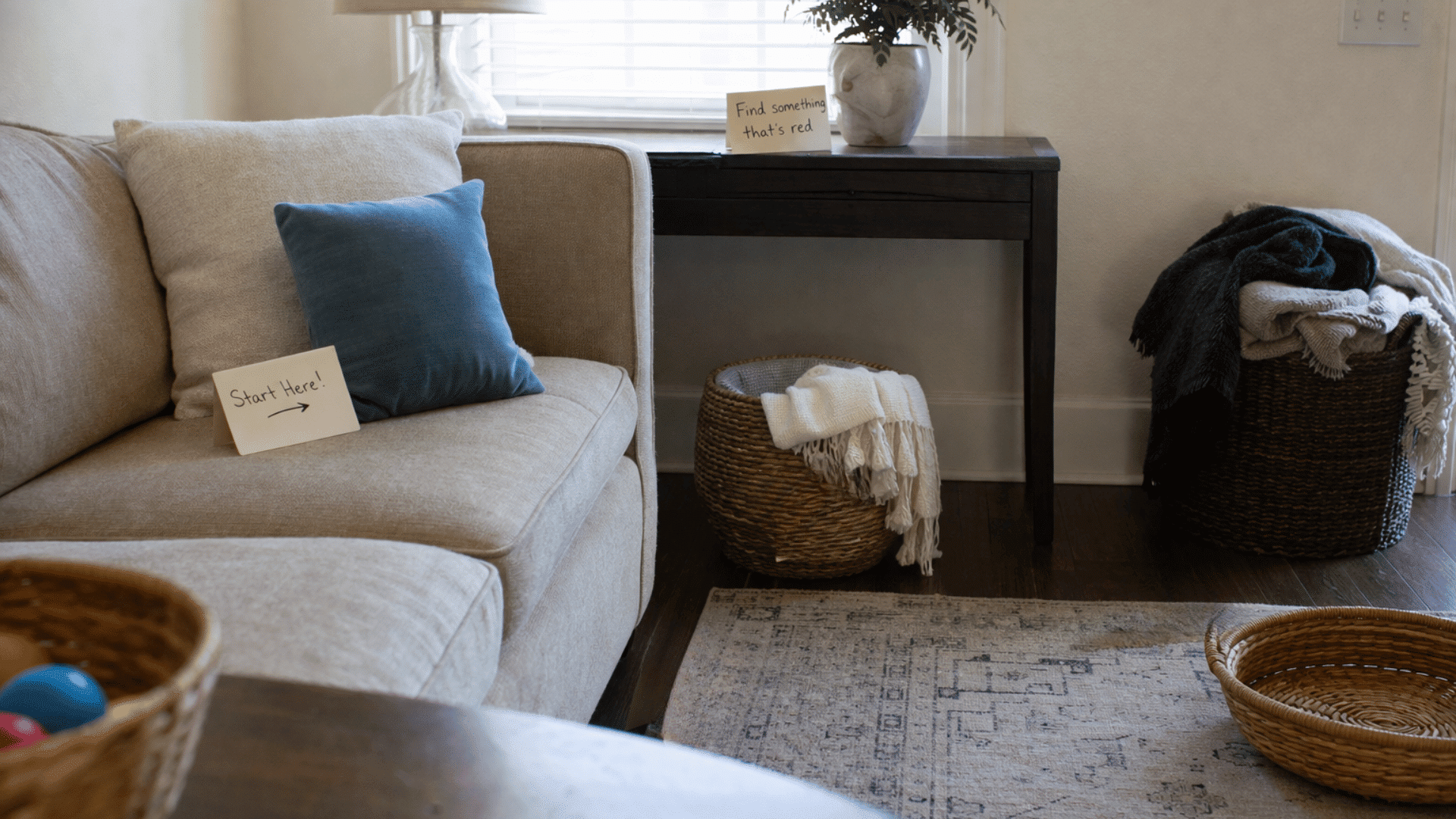 cozy living room setup with treasure hunt clue cards placed near sofa and table, creating a fun indoor activity for kids.