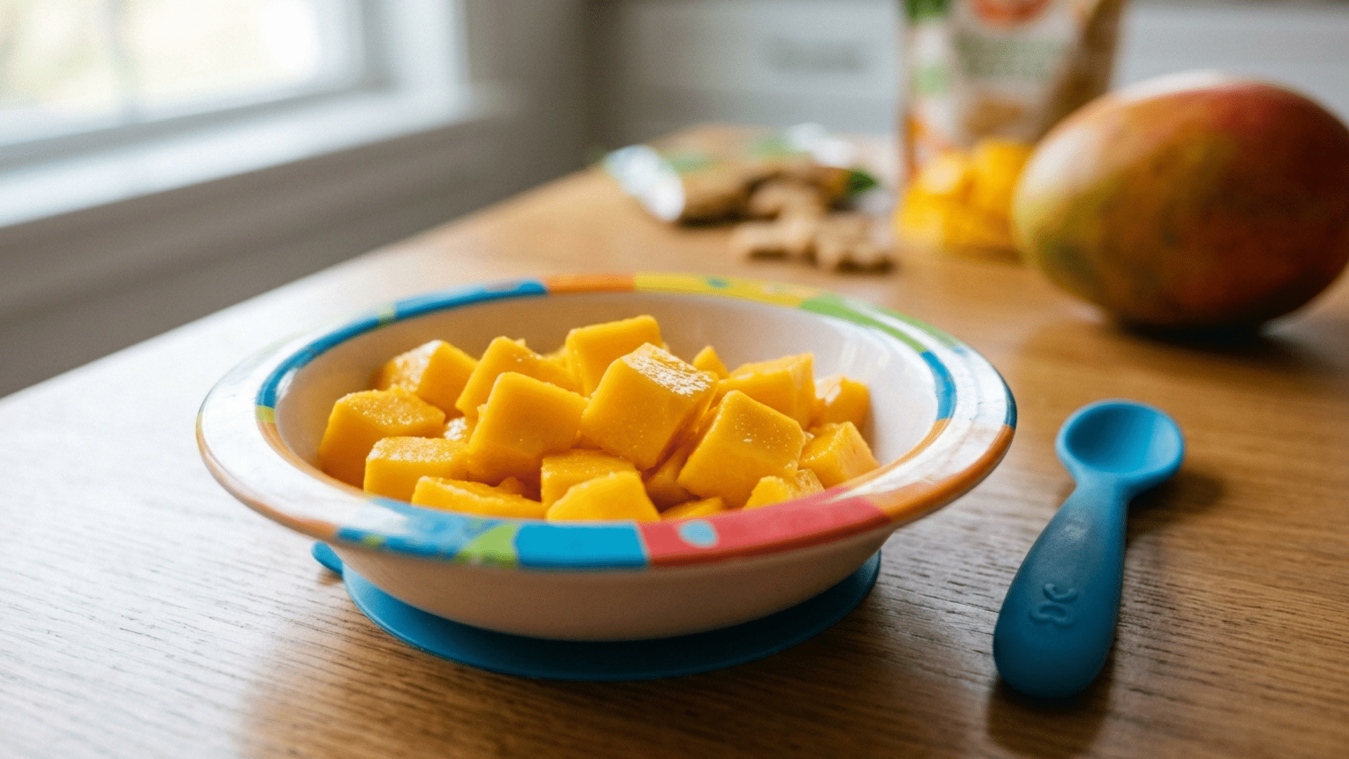fresh mango cubes in a bowl ready to serve as a healthy toddler snack.