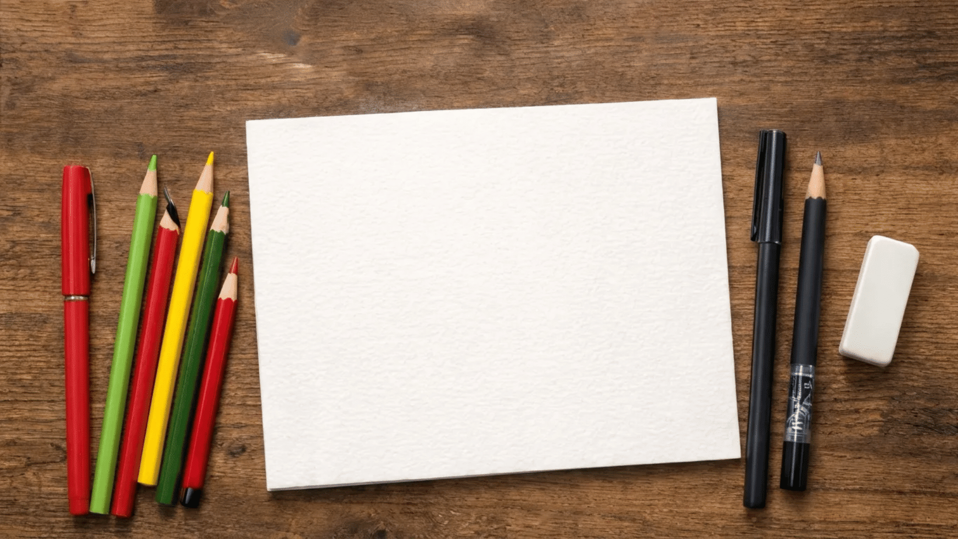 gather materials including pencils, pens, eraser, and cardstock paper