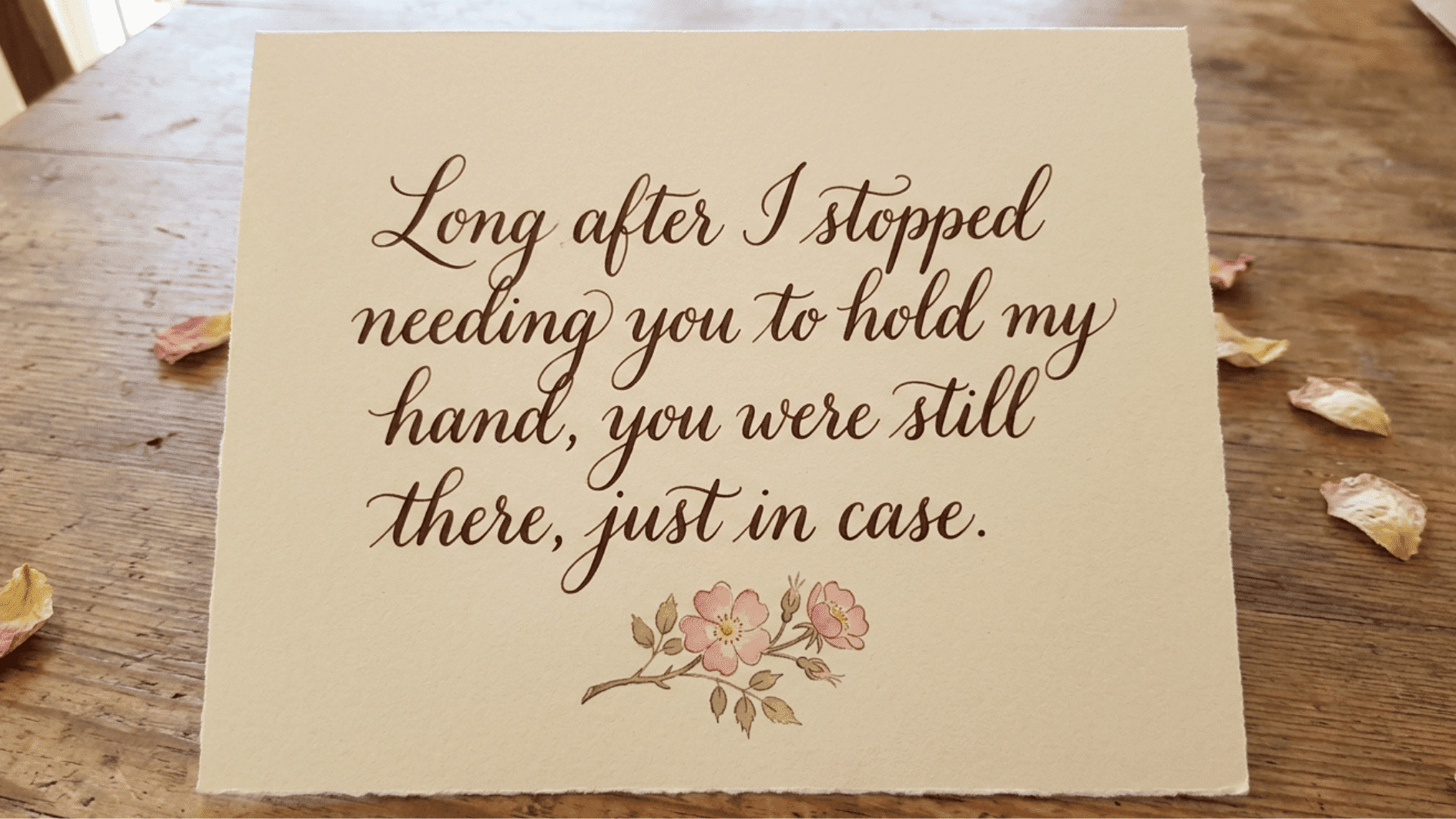 handmade-style card with an emotional message about a mother’s lasting support, placed on a rustic wooden table with petals