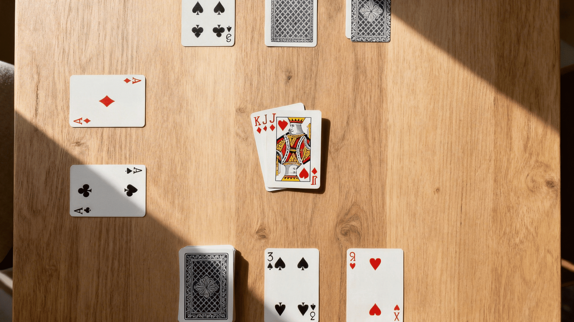 playing cards and memory game cards arranged neatly in rows on a table for an organized game setup (1)