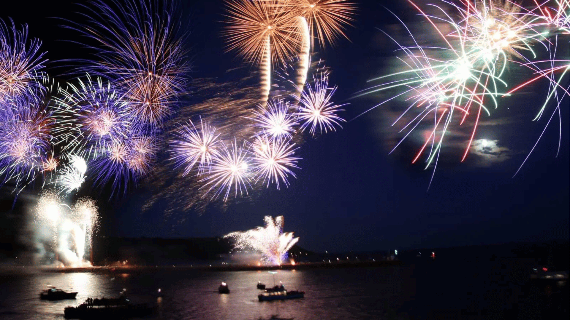 colorful memorial day fireworks over the water during a summer evening celebration