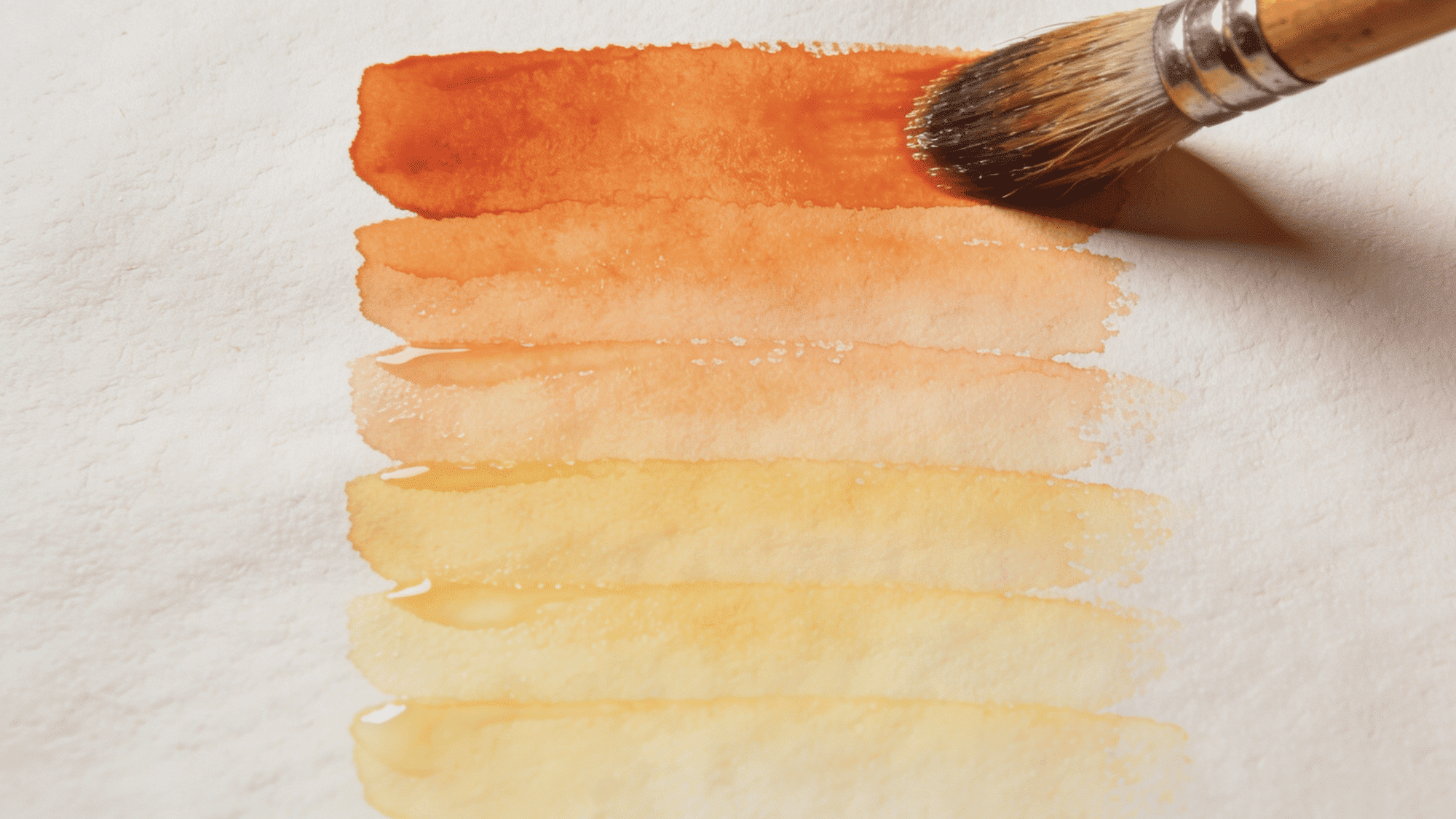 watercolor gradient swatches from yellow to deep orange with soft layered brush strokes