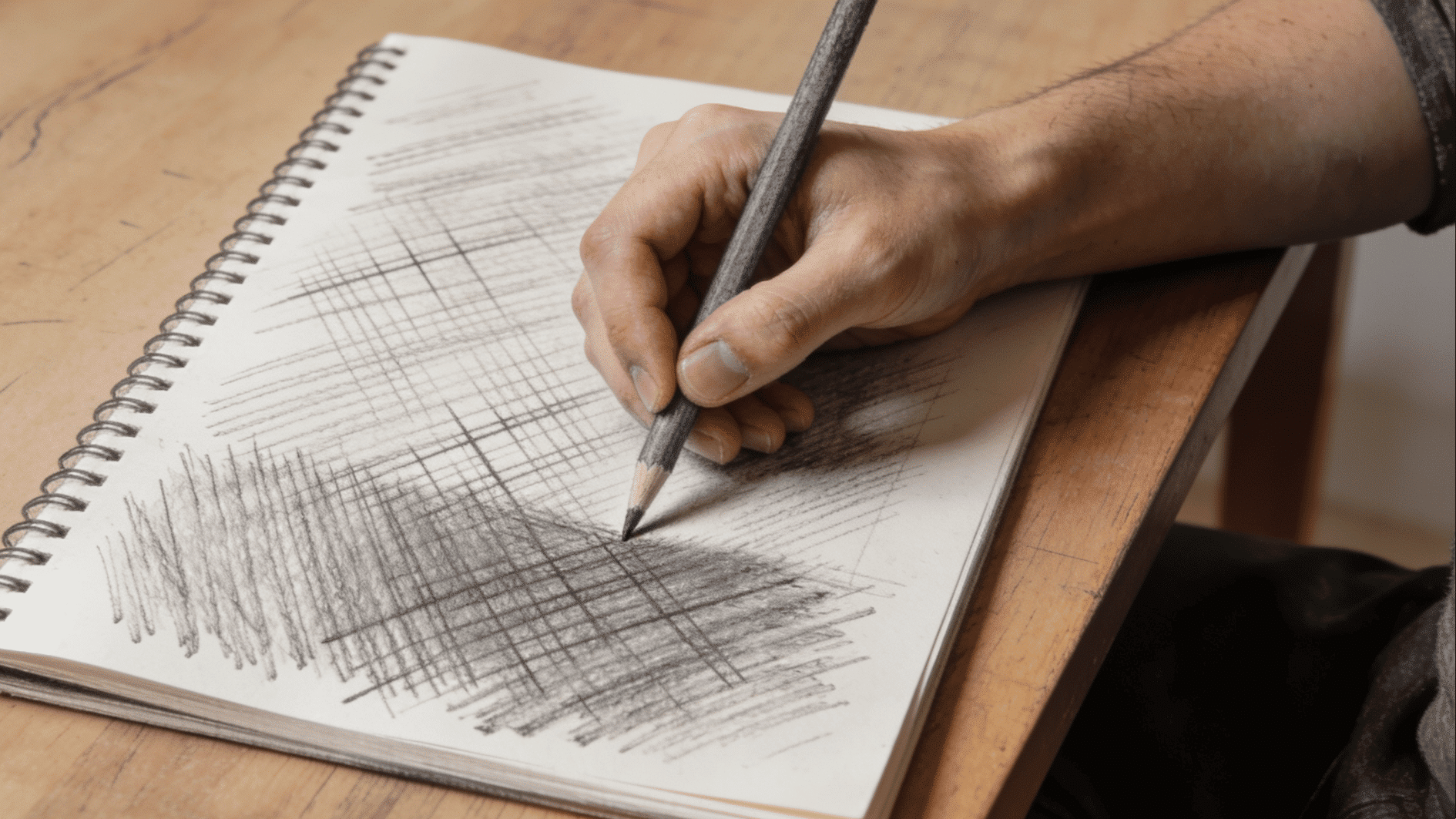 a person using hatching and cross hatching method for their drawing and on the other side a full drawing made using this method of crossing