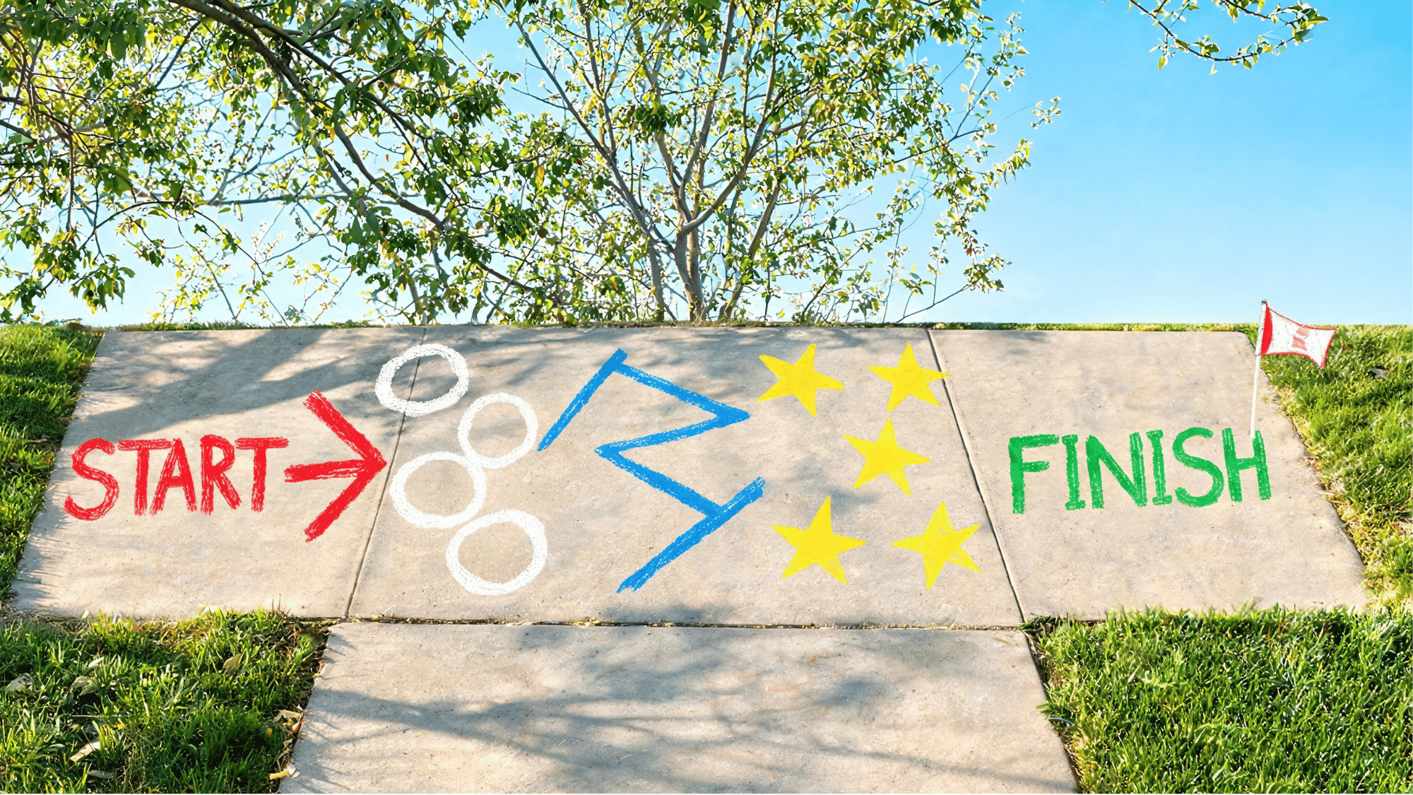 playful sidewalk chalk obstacle course with arrows, jumping circles, zigzag lines, start and finish points