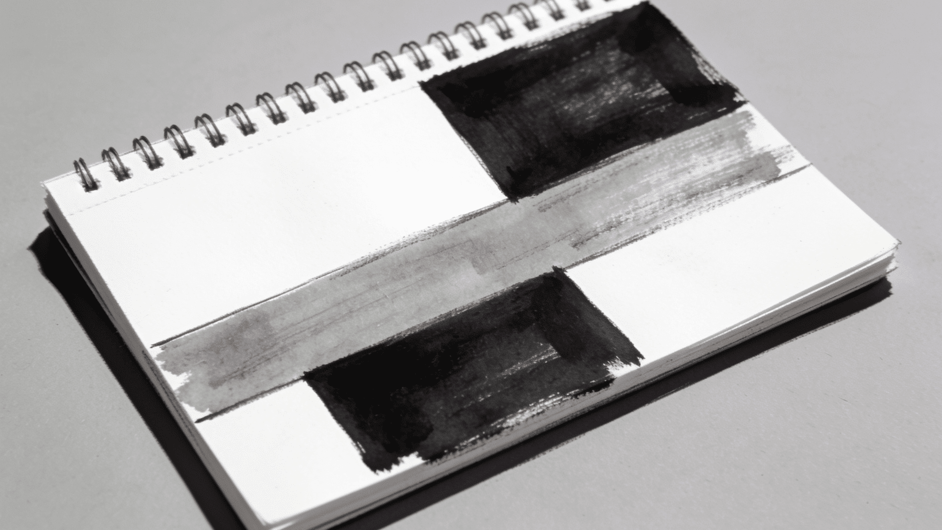 _small compositional thumbnail sketch divided into three clean flat zones — white, mid-gray, and black — with no blending or gradation anywhere. bold, graphic, almost design-like in appearance on