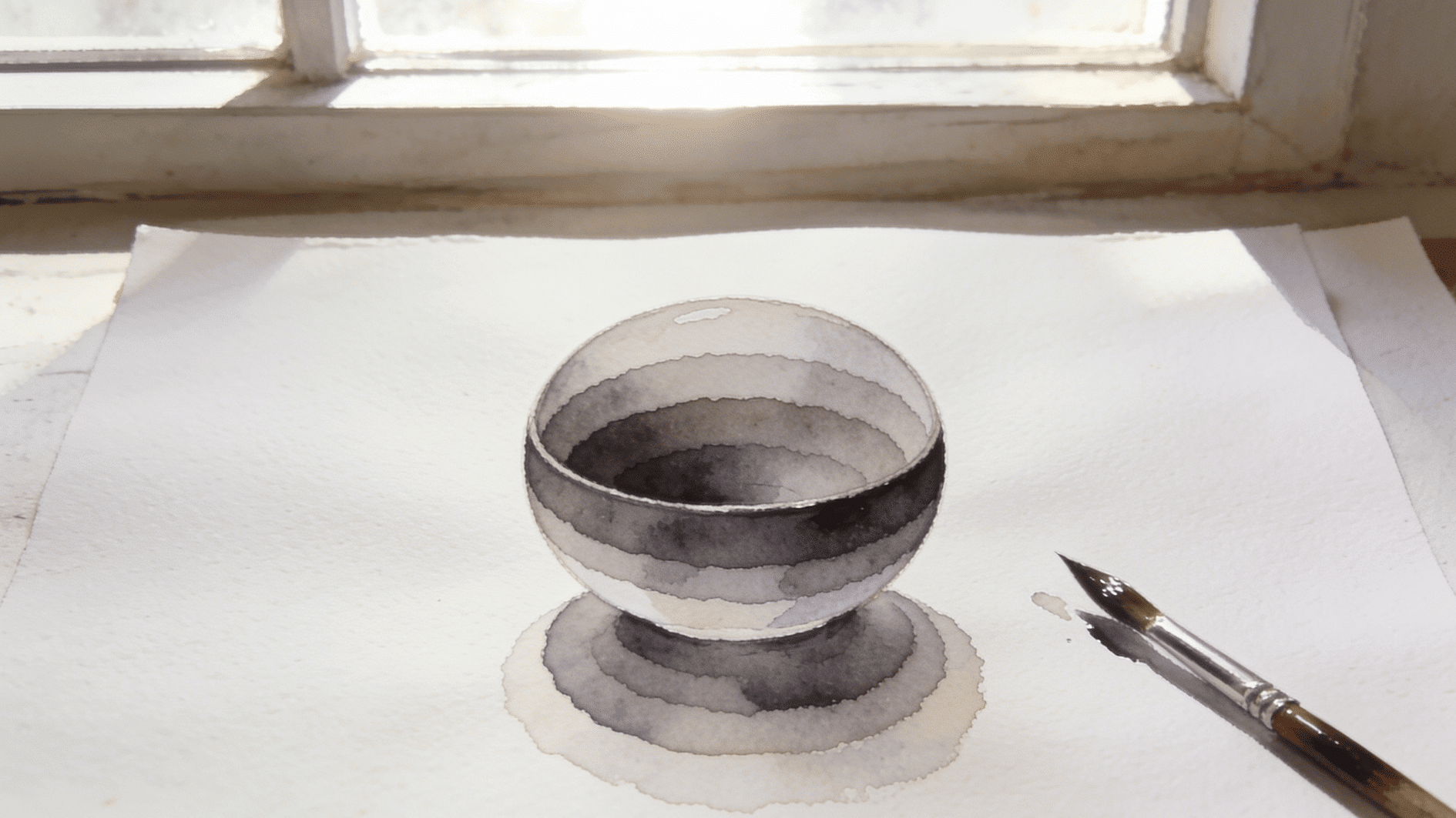 watercolor study of a simple form showing visibly distinct transparent washes layered over each other, each wash slightly darker than the last, wet brush resting beside the paper, natural window l