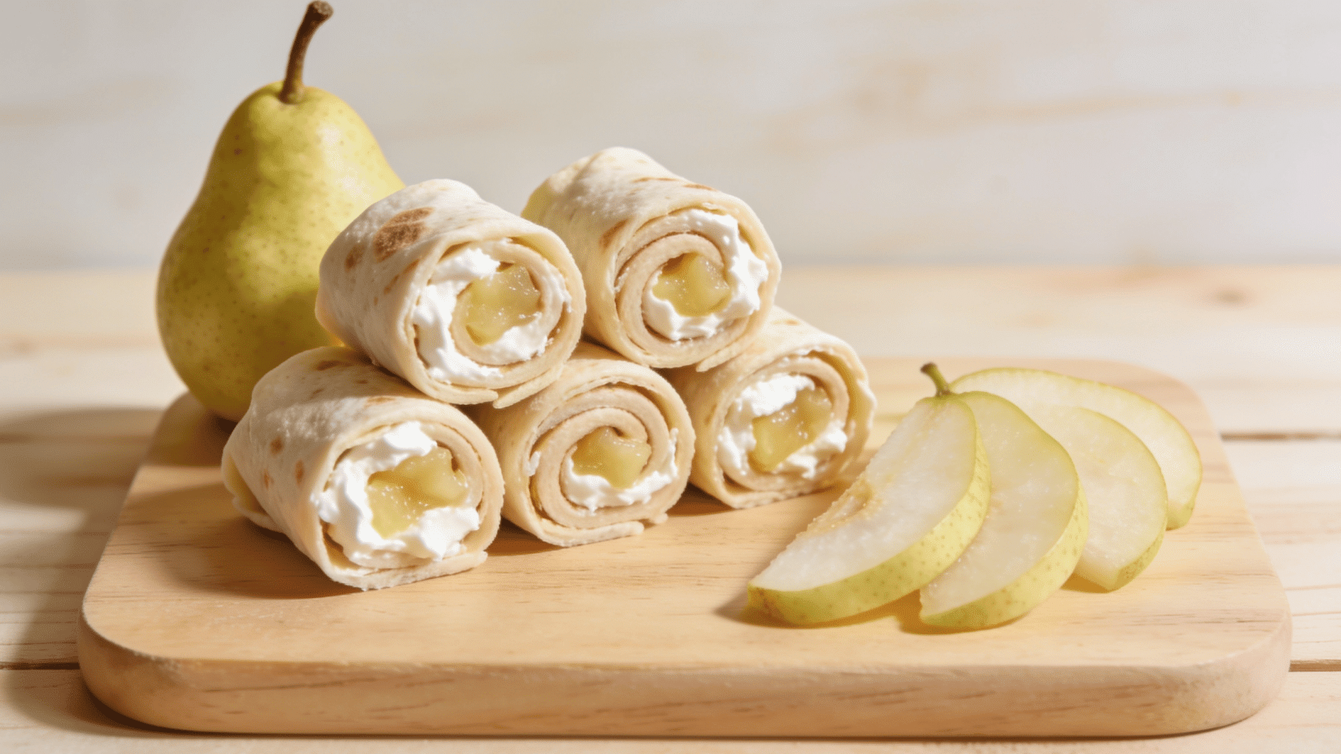 Alt Text pear and ricotta tortilla roll ups sliced into soft spiral pieces for a toddler meal (1)