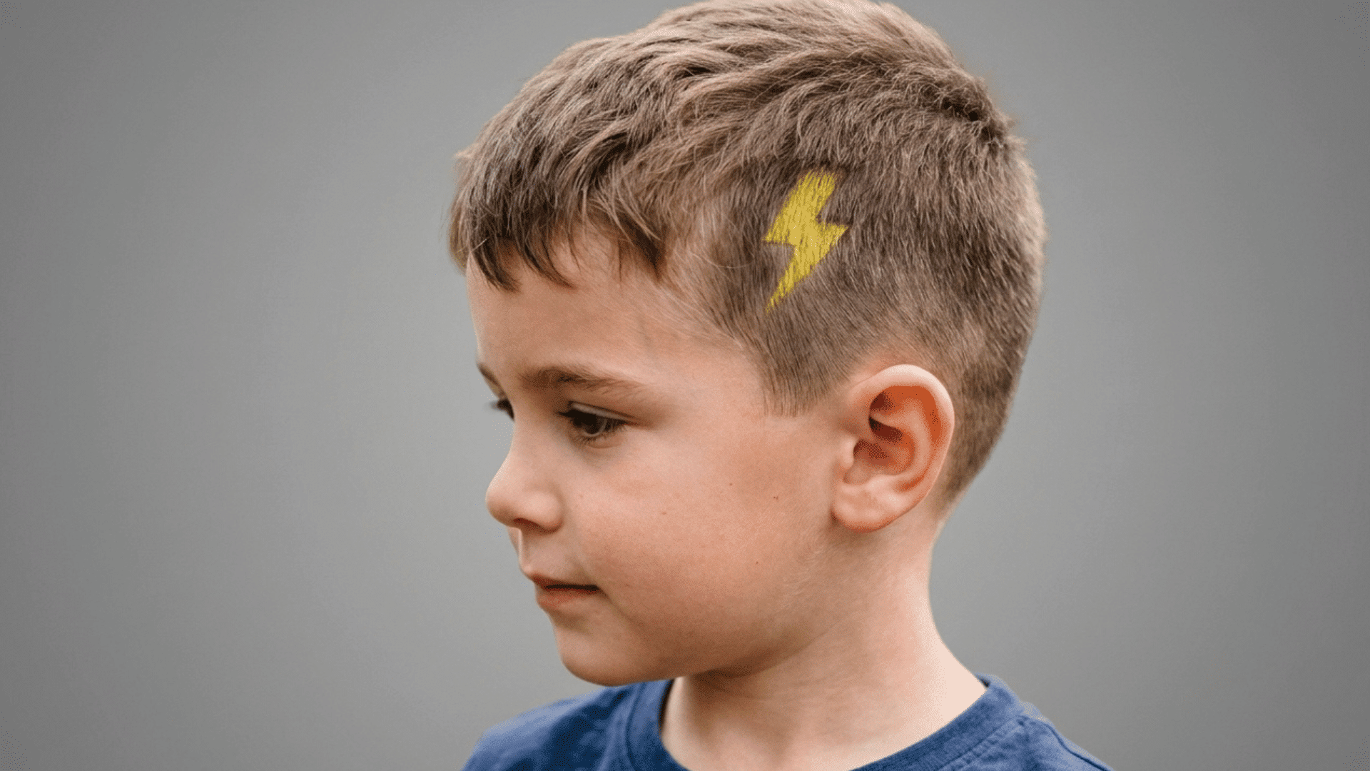 lightning bolt shape sprayed near a boy's hairline
