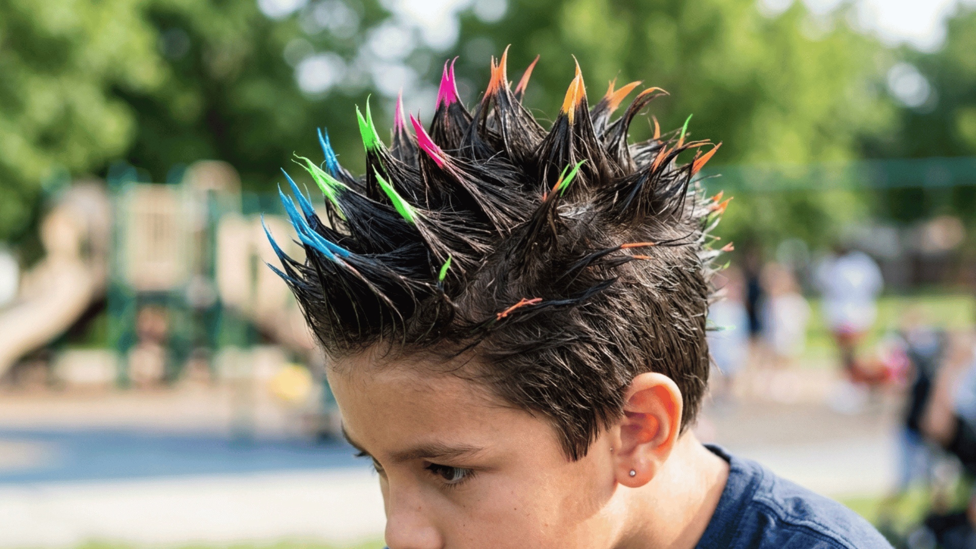neon-colored tips on a boy's short gelled hair spikes