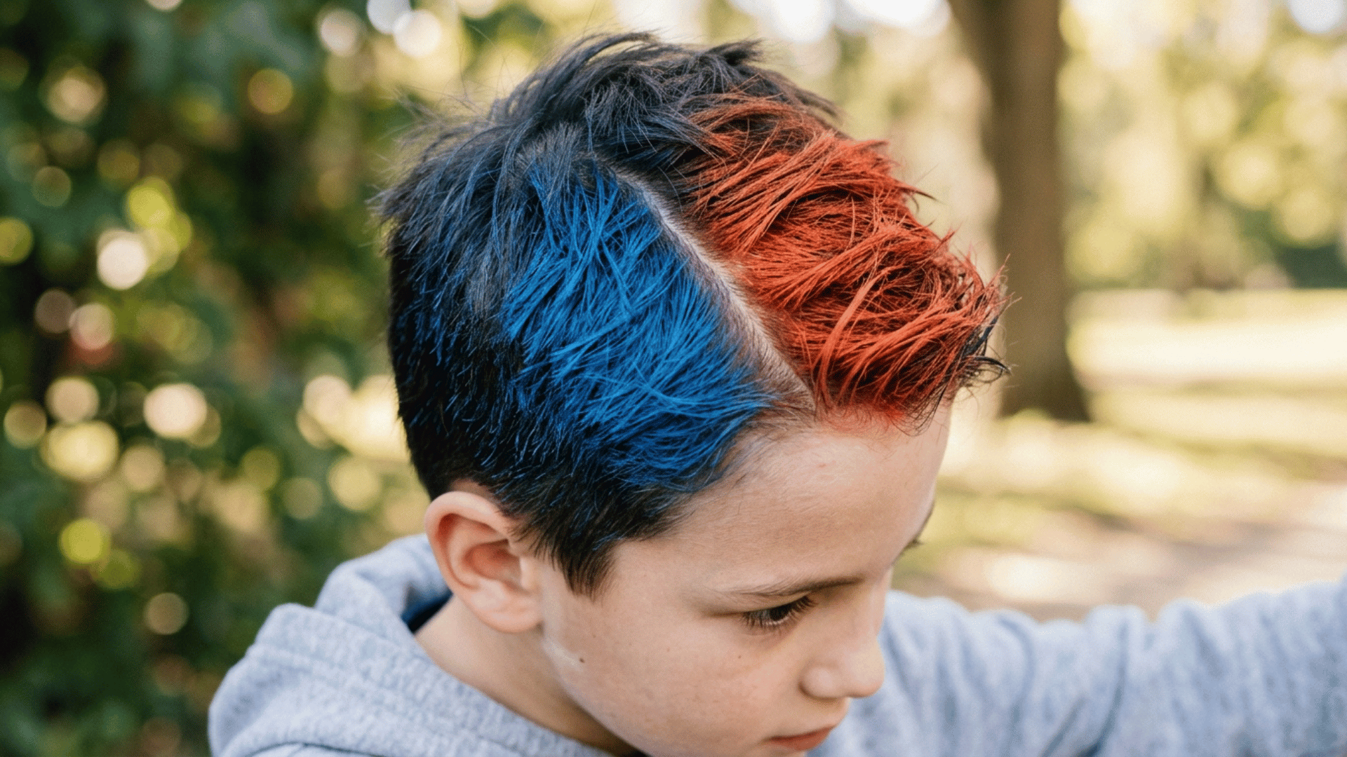 boy's short hair sprayed two different colors down the middle