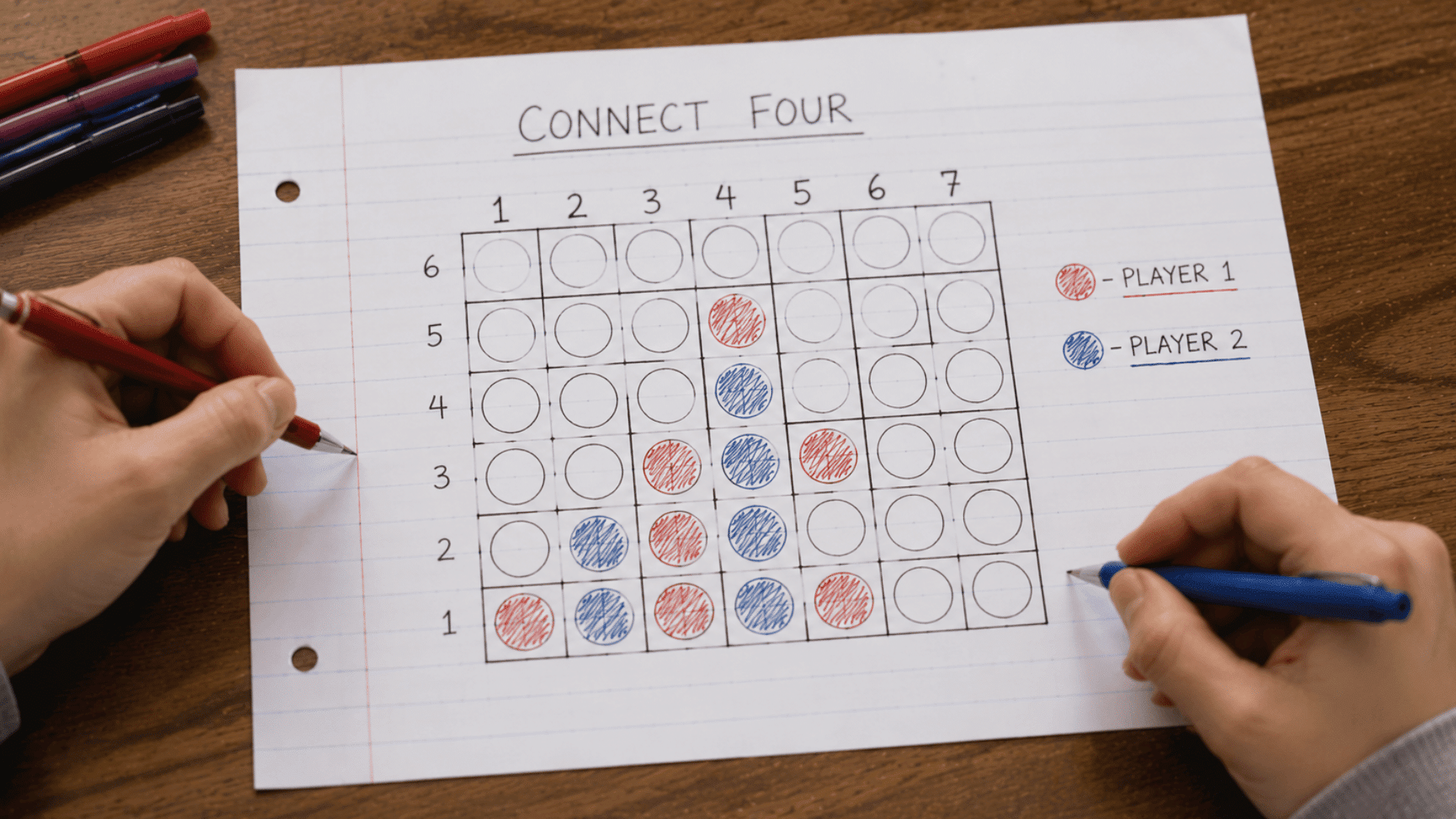 connect four game hand-drawn on lined paper being played with red and blue pens