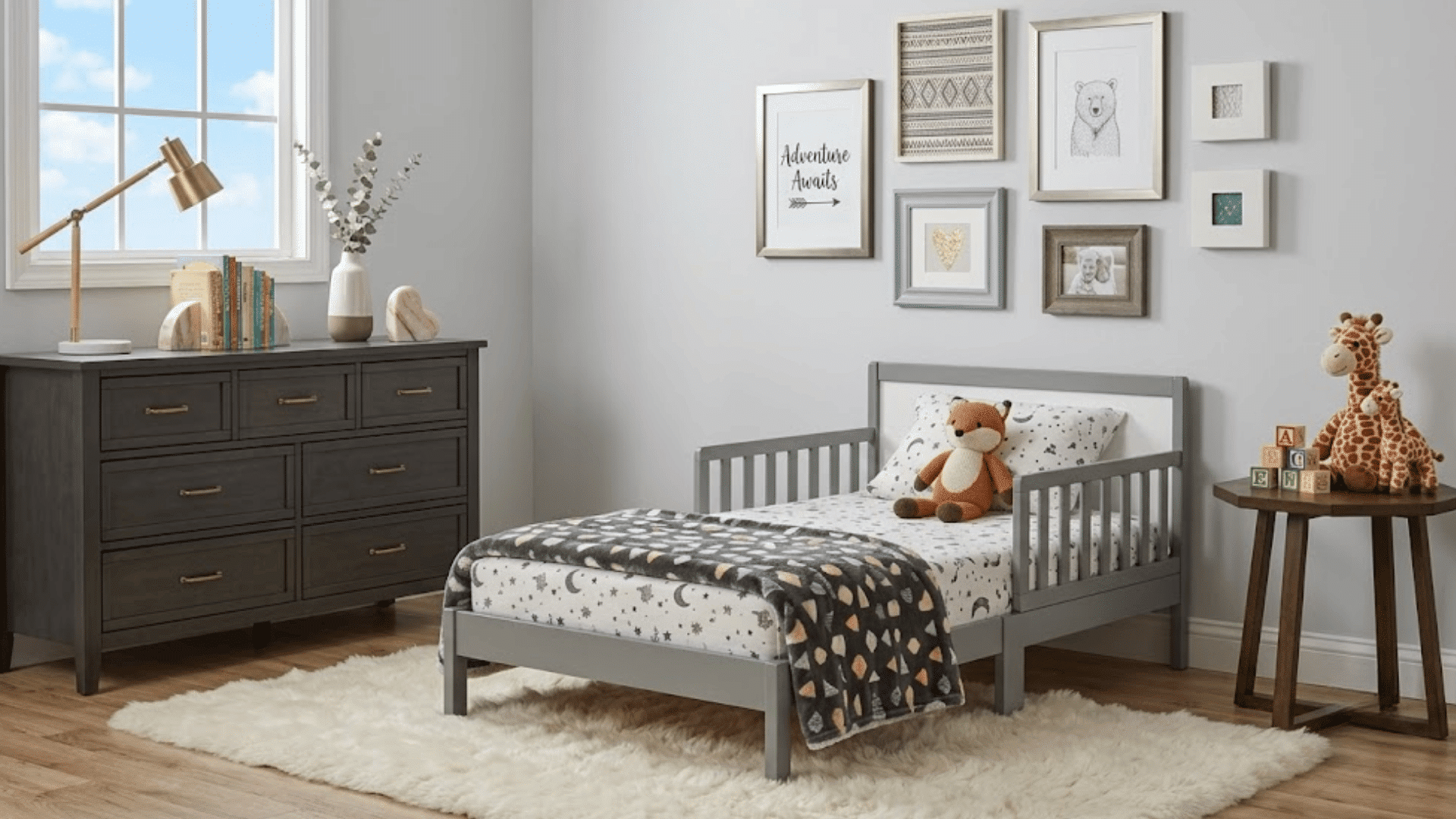cozy toddler bedroom with low bed, stuffed toys, dresser, and safe sleep setup for transition