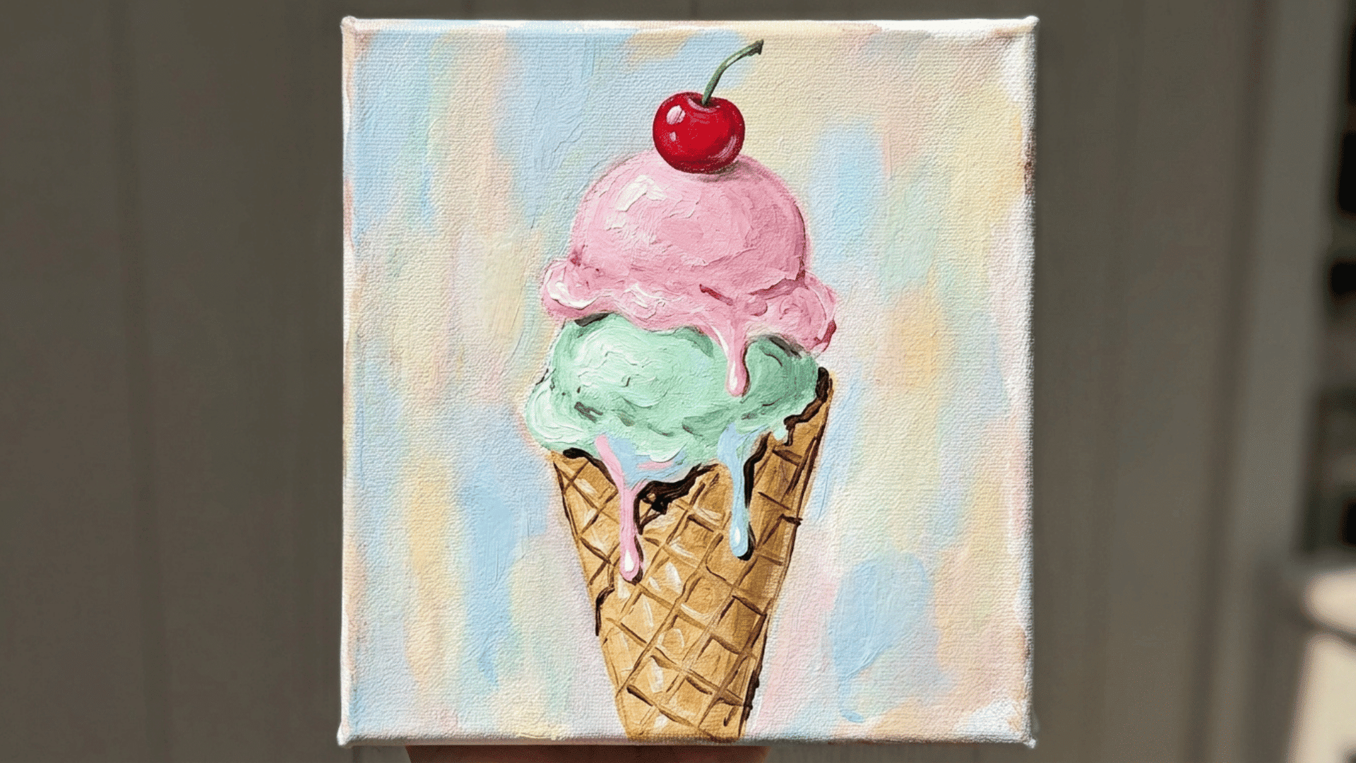 pastel ice cream scoops dripping down a waffle cone