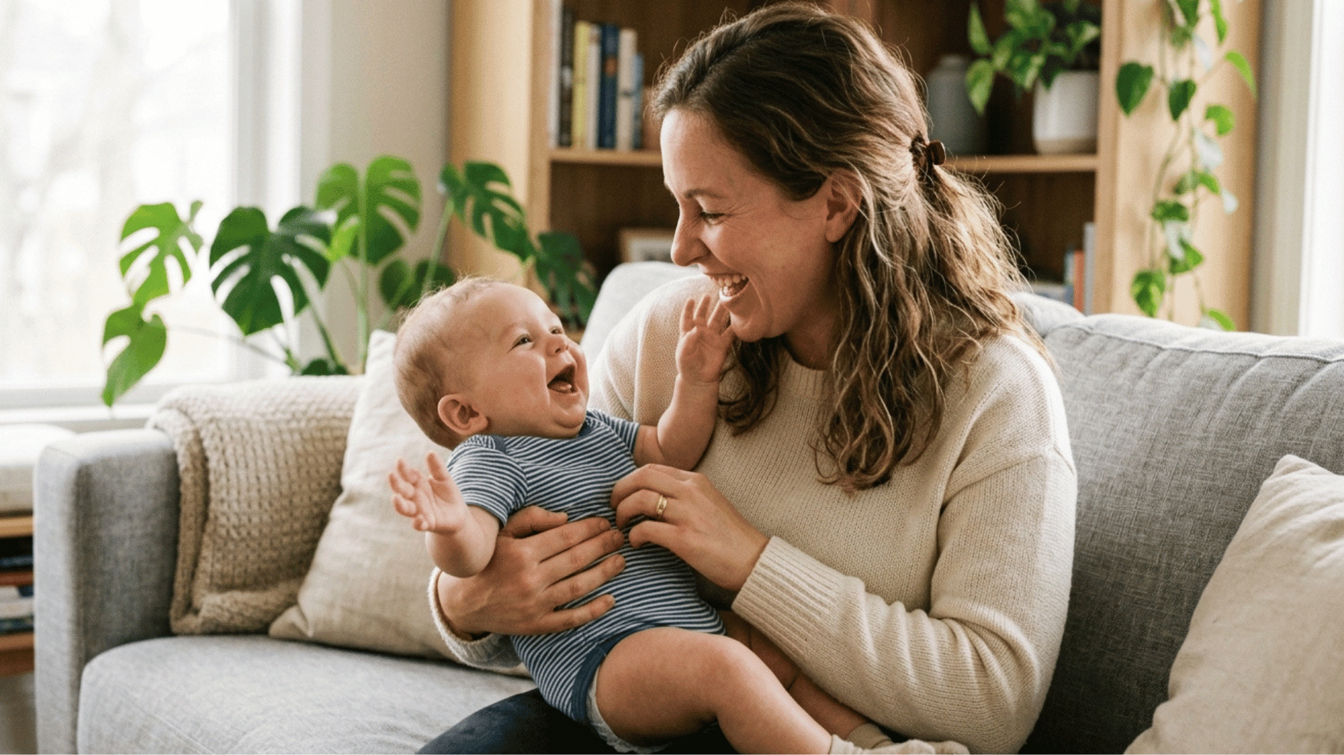 a mother holding her son in her arms and playing with him