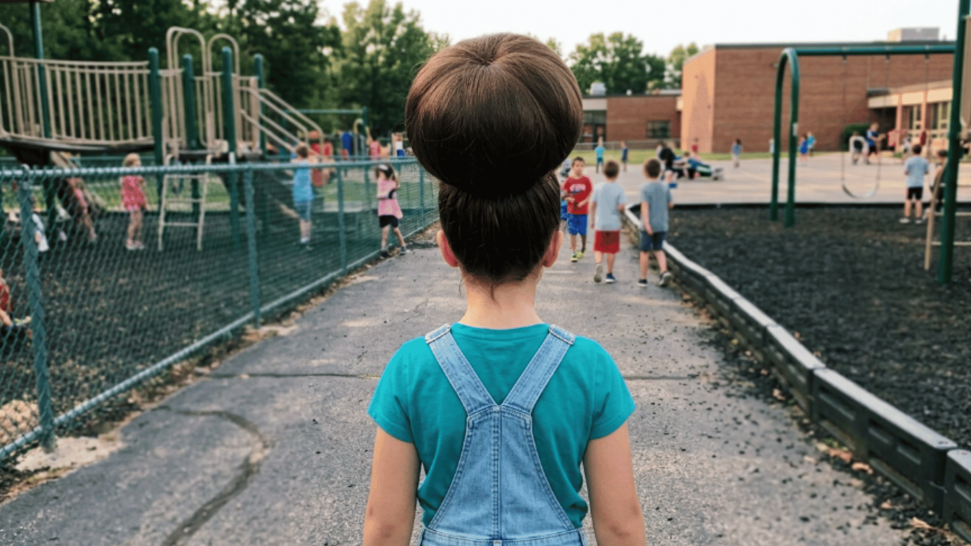 oversized round balloon bun on brunette hair at school playground