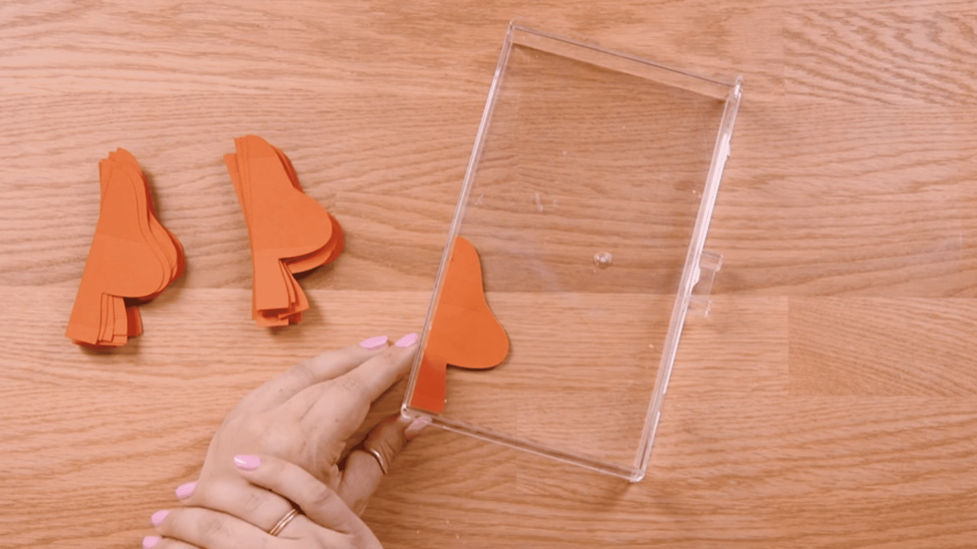 placing a second cardstock piece on top and aligning edges carefully using a box corner for support