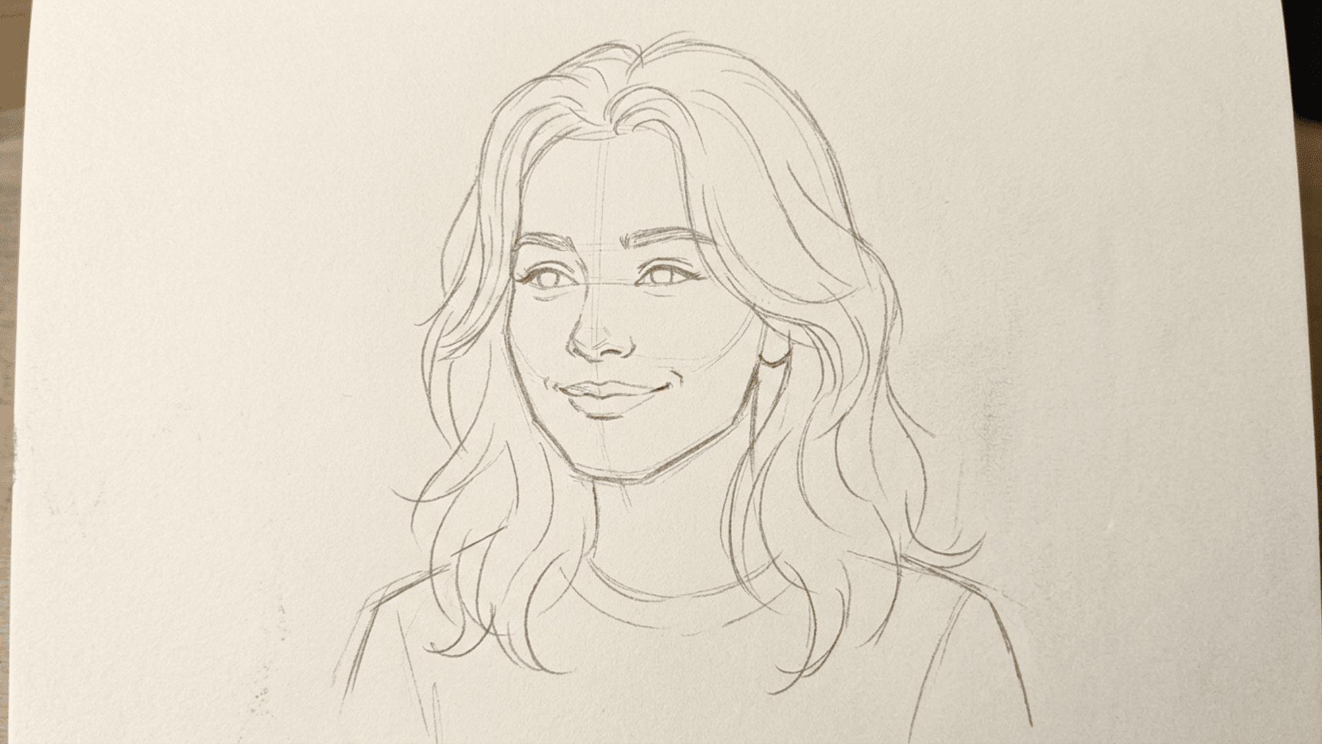 pencil sketch of a basic face portrait using light guidelines for eyes, nose, and mouth
