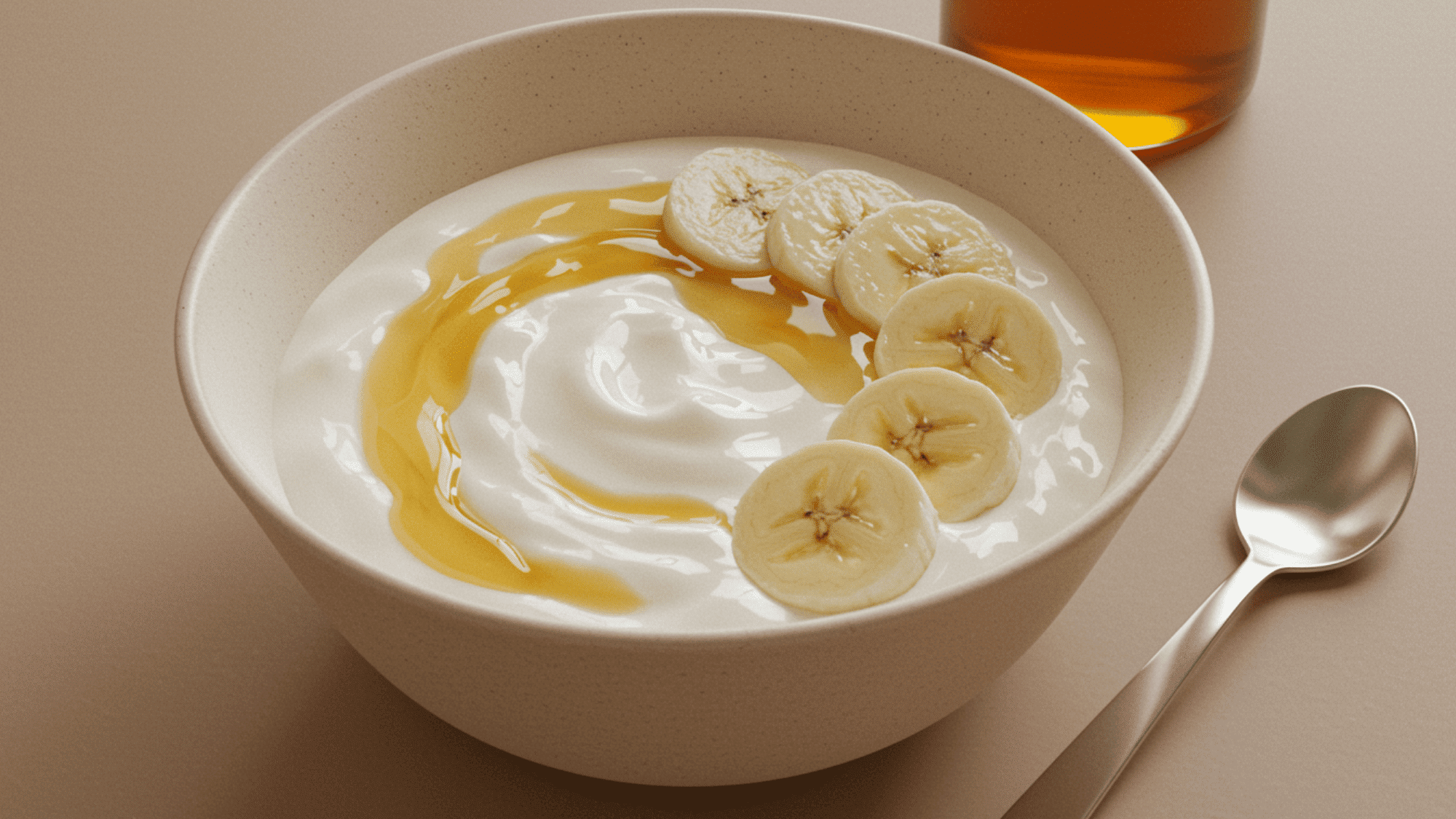 yogurt with soft mixed berries, creamy swirl, close-up bowl, natural morning light, delicate spoon