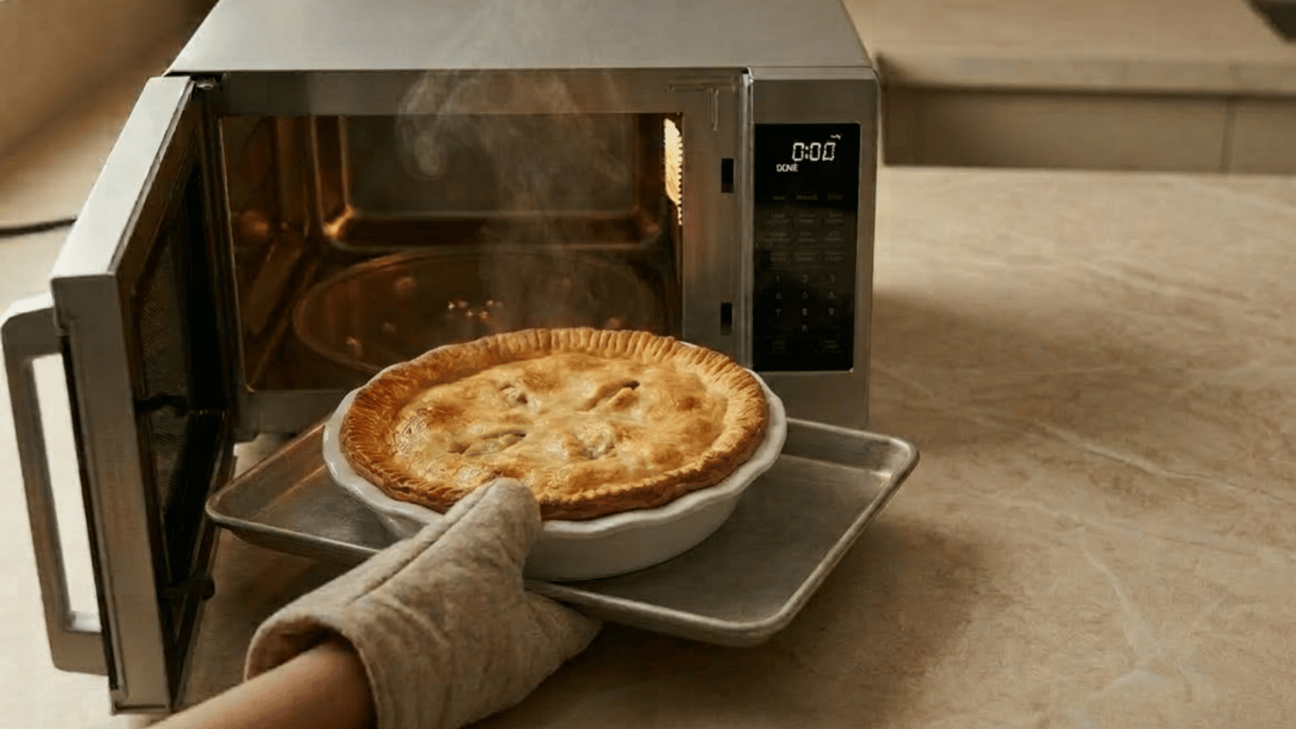 golden baked chicken pot pie pulled from the oven with a mitt