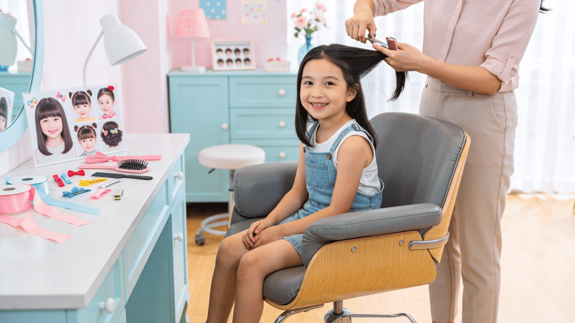 image showing a cheerful little girl sitting in a modern kids’ salon chair while a hairstylist gently trims her hair, with a soft display of different cute haircut styles shown through nearby