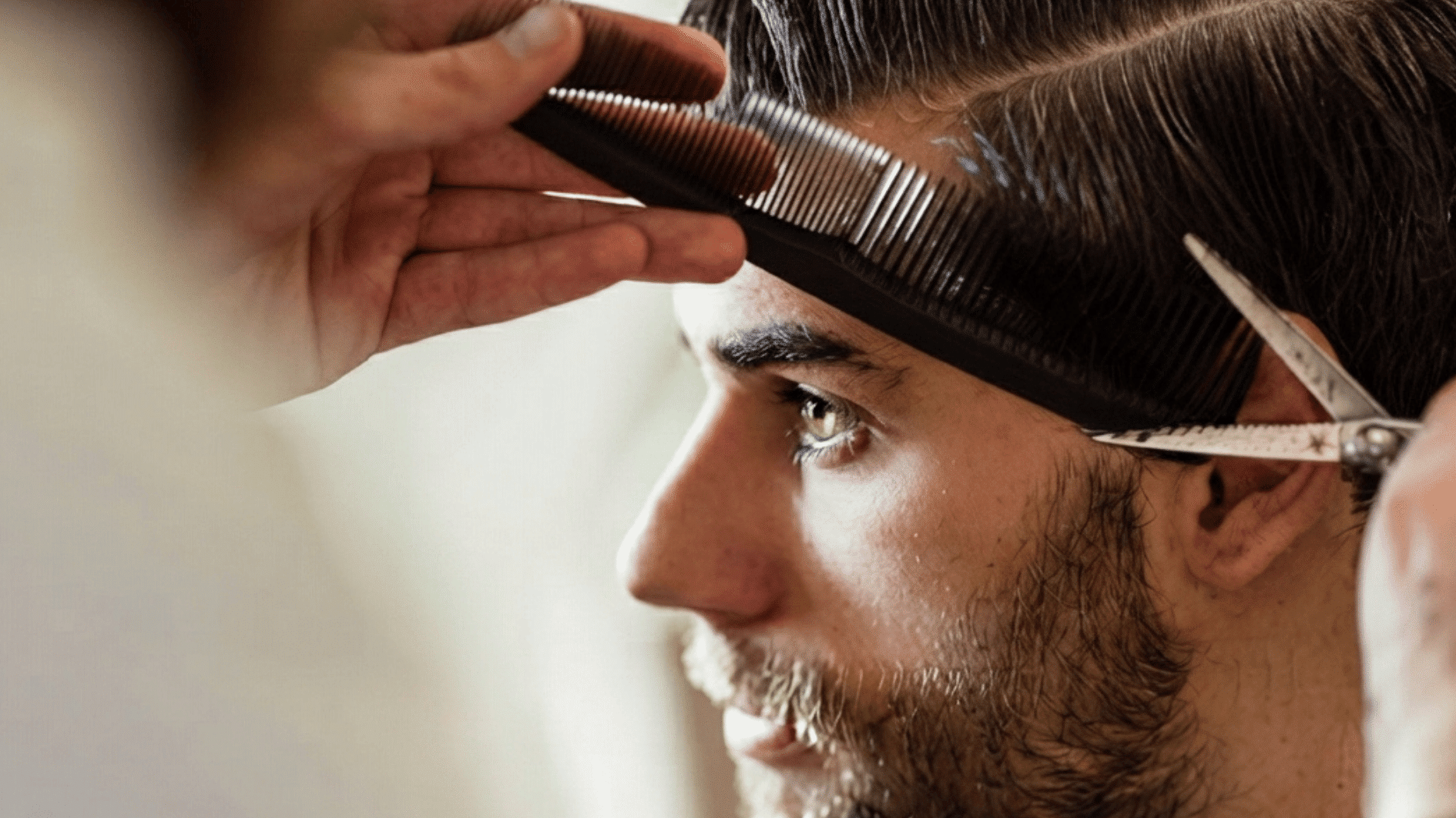 man getting haircut by barber