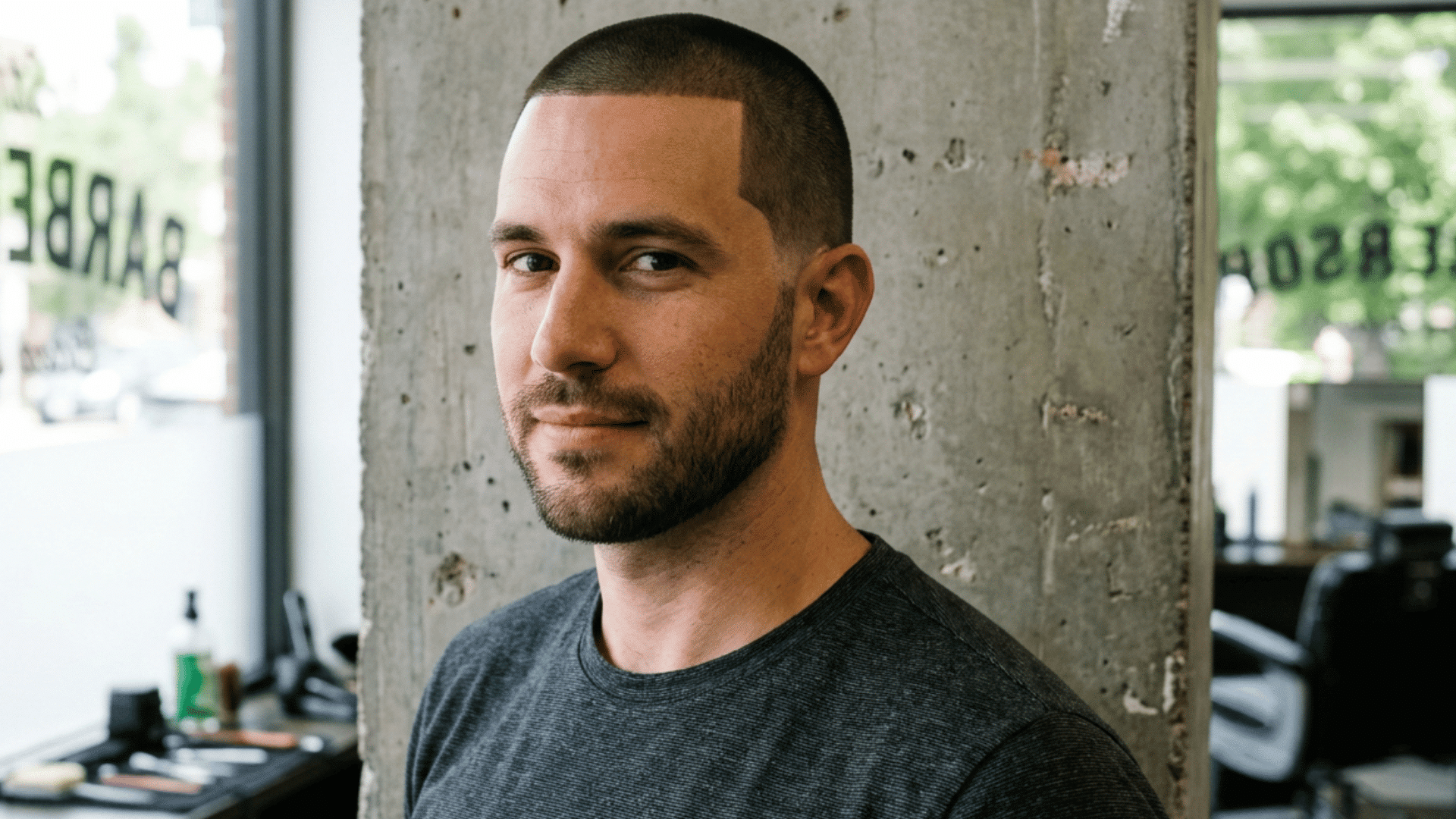 man with an oval face wearing a clean number four buzz cut and sharp lineup