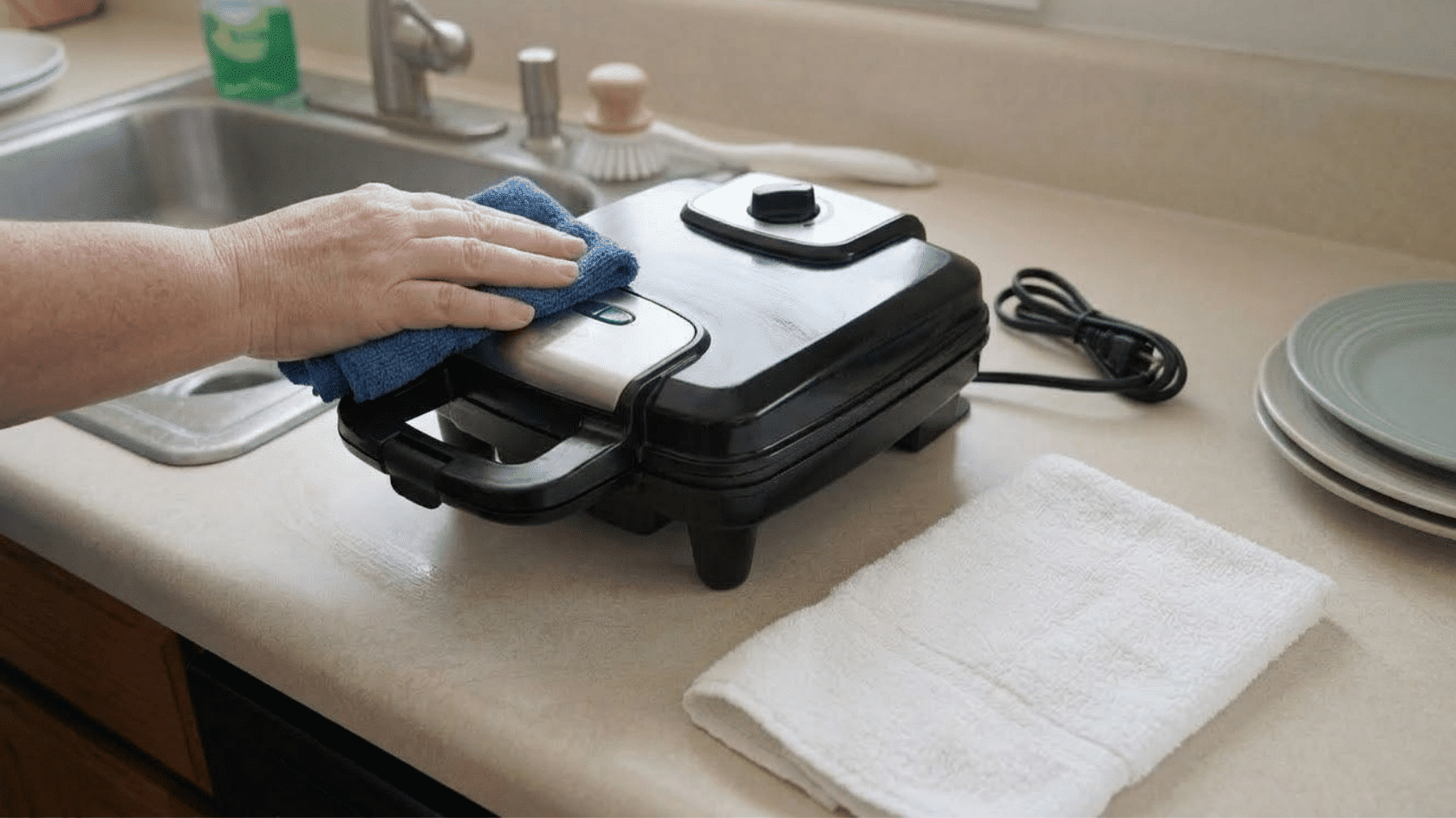 wiping the outside of a waffle maker